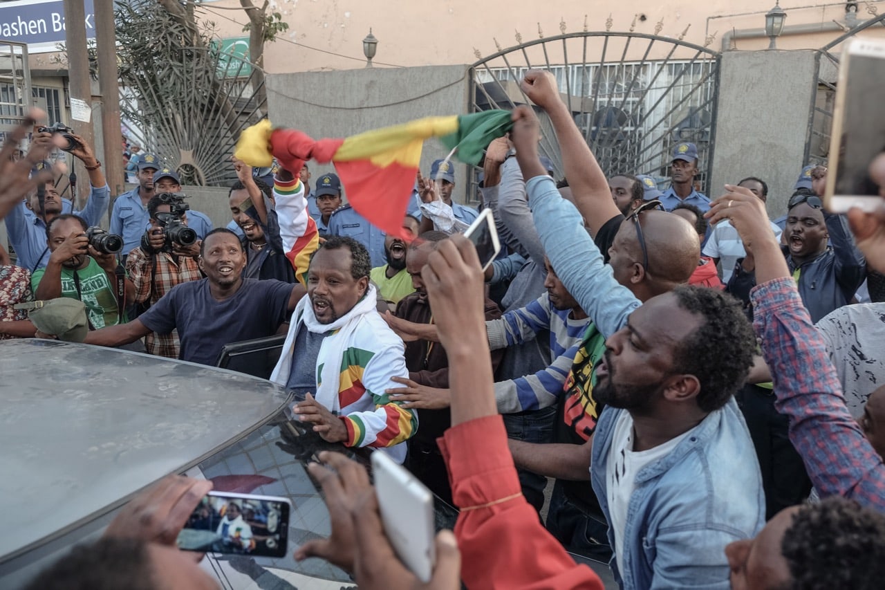 People react as Ethiopian jounalist Eskinder Nega (unseen) is released from Kaliti Prison, in Addis Ababa, 14 February 2018, YONAS TADESSE/AFP/Getty Images