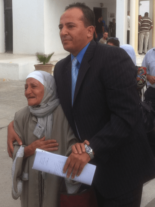 Samir Feriani and his mother outside the Tunisian military court in Bab Sa’adoun on Thursday, awaiting the verdict in his trial., Ghias Aljundi/غياث الجندي