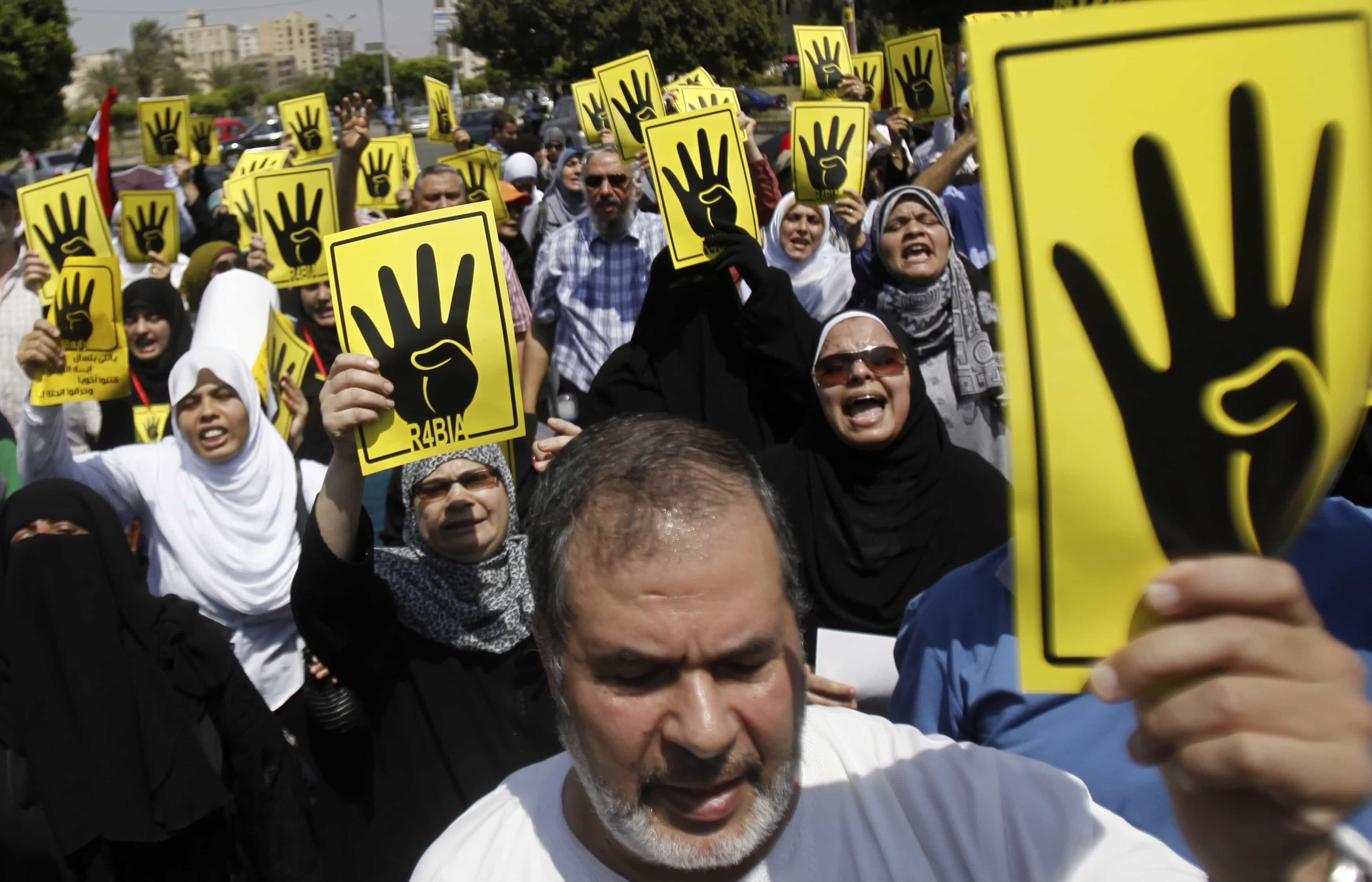 The four-fingered-salute was first used by Egyptian masses wanting to remember the Rabaa Al-Adawiya protesters supporting ousted president Mohammed Morsi who were brutally dispersed by the military in Egypt on 14 August 2013, REUTERS/Amr Abdallah Dalsh