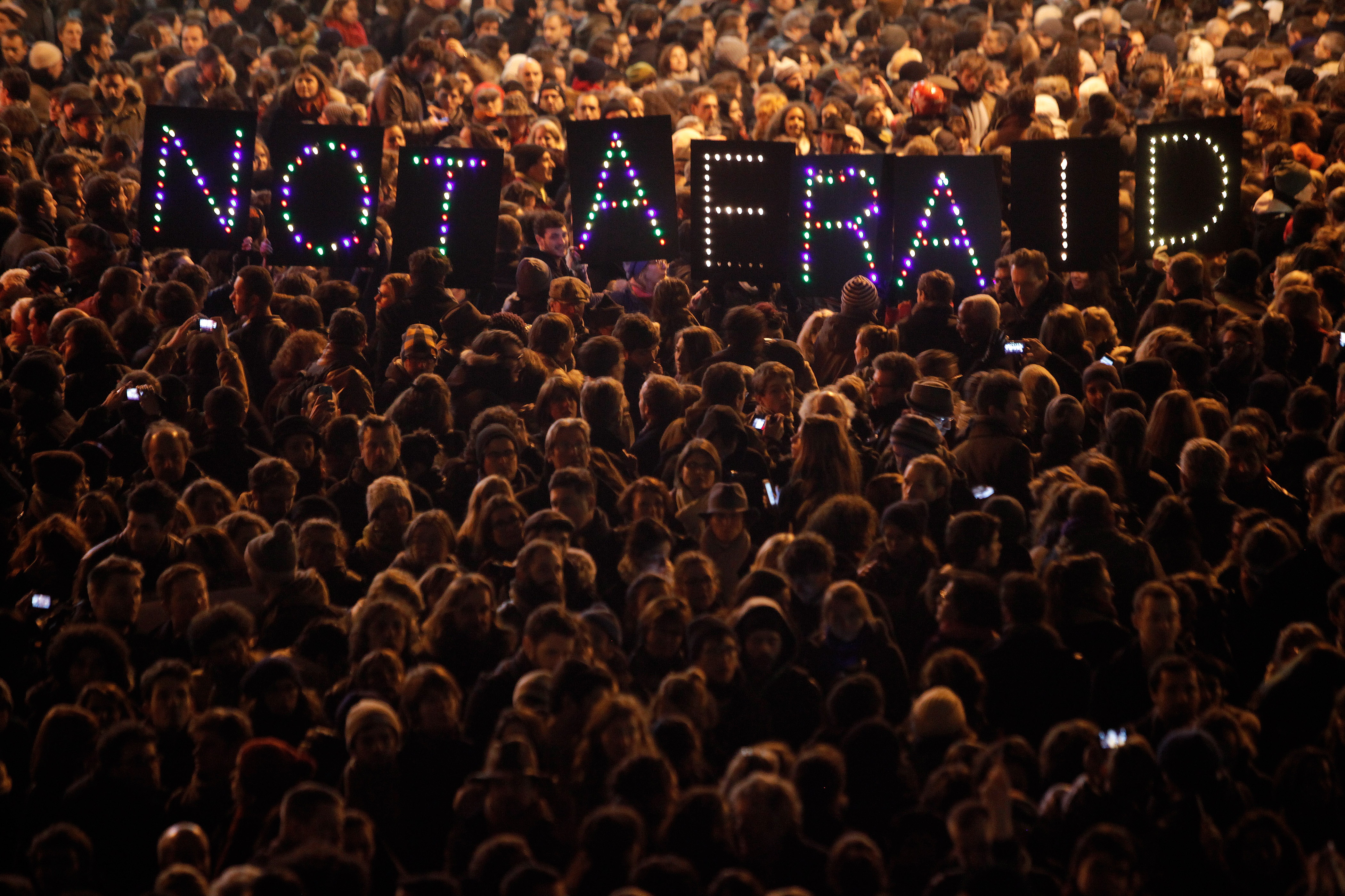 People gather in solidarity with the victims of an attack against satirical magazine Charlie Hebdo, in Paris, 7 January 2015, AP Photo/Thibault Camus