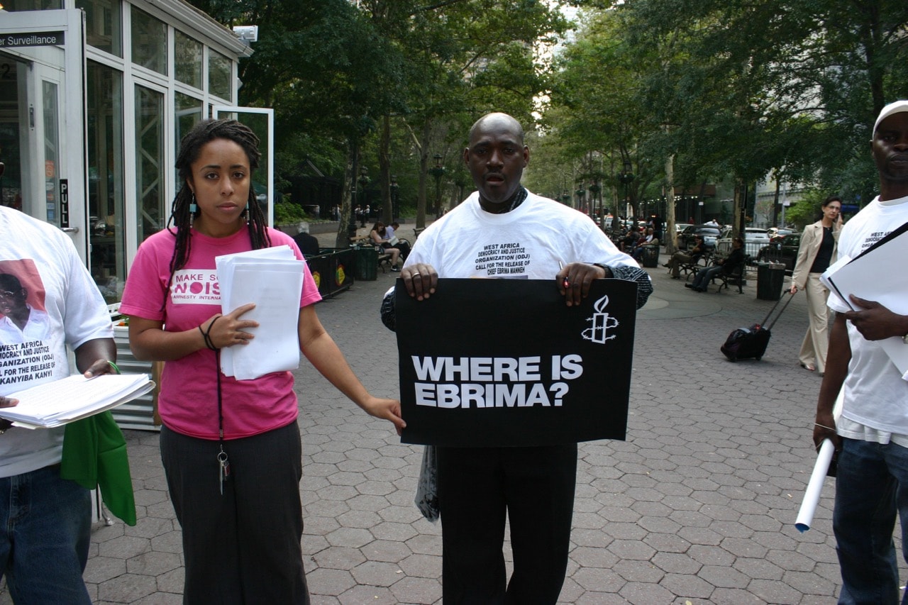 Activists from the West African Democracy and Justice Organization hold a peaceful protest near the UN building with posters and t-shirts emblazoned with the face of journalist Chief Ebrima Manneh, 22 July 2009, Flickr/Carlton Purvis