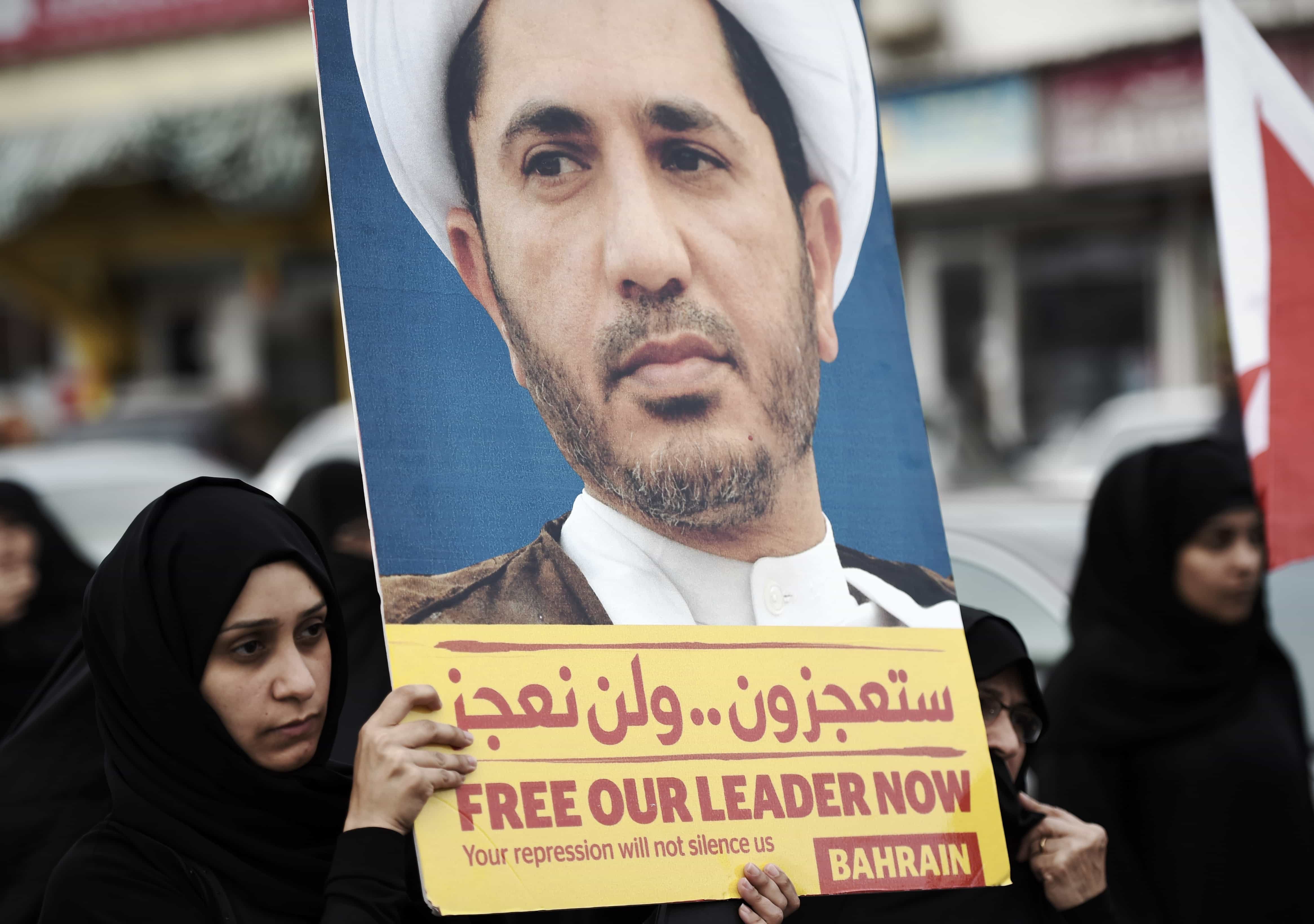 A Bahraini female protester holds a placard portraying Sheikh Ali Salman, head of the Shiite opposition movement Al-Wefaq, on March 24, 2015, during a demonstration against his arrest, in the village of Daih, west of Manama. Salman is behind bars for allegedly trying to overthrow the regime. His arrest on December 28, 2014, shortly after he was re-elected head of Bahrain's main opposition party Al-Wefaq, has sparked near-daily protests in Shiite villages., MOHAMMED AL-SHAIKH/AFP/Getty Images