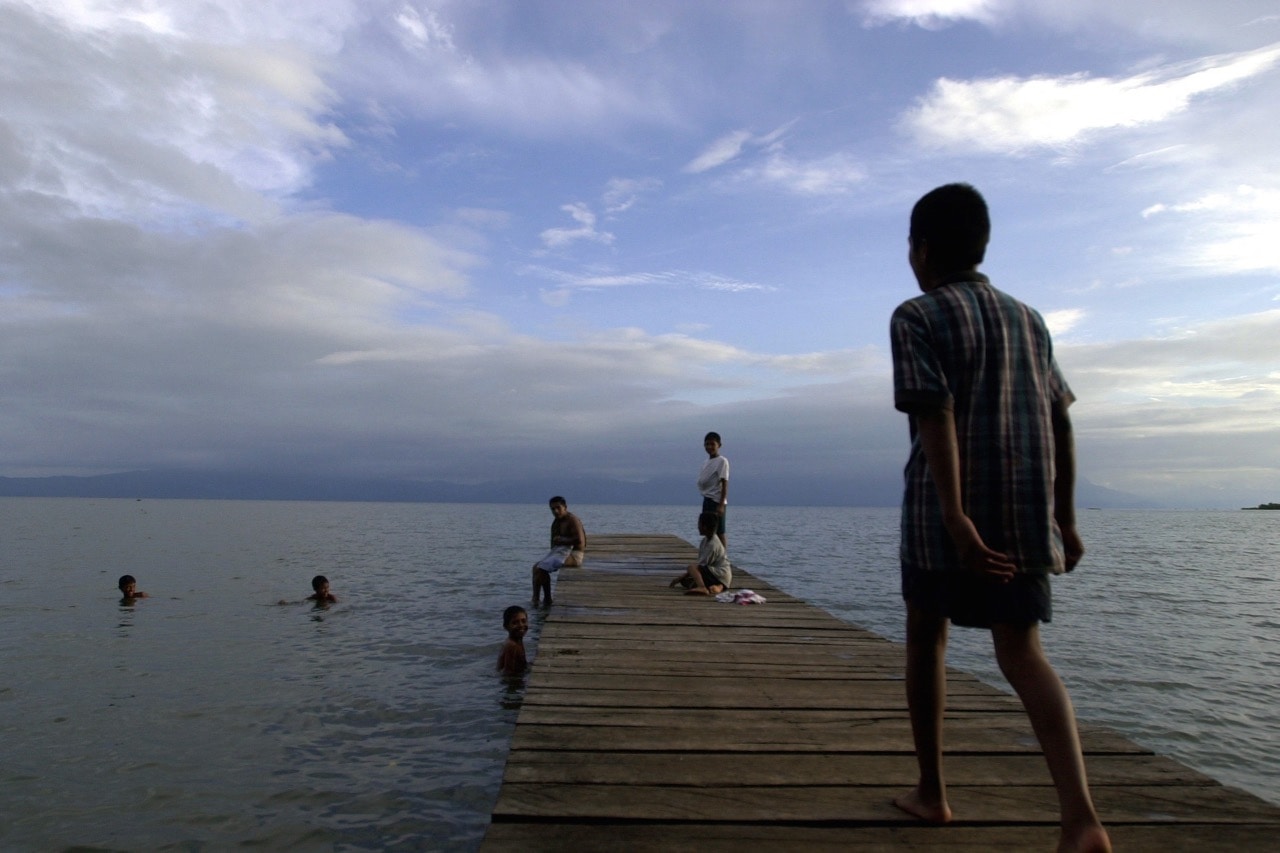 Children play in Izabal Lake in La Ensenada Village, Guatemala, 26 August 2002, AP/Jaime Puebla