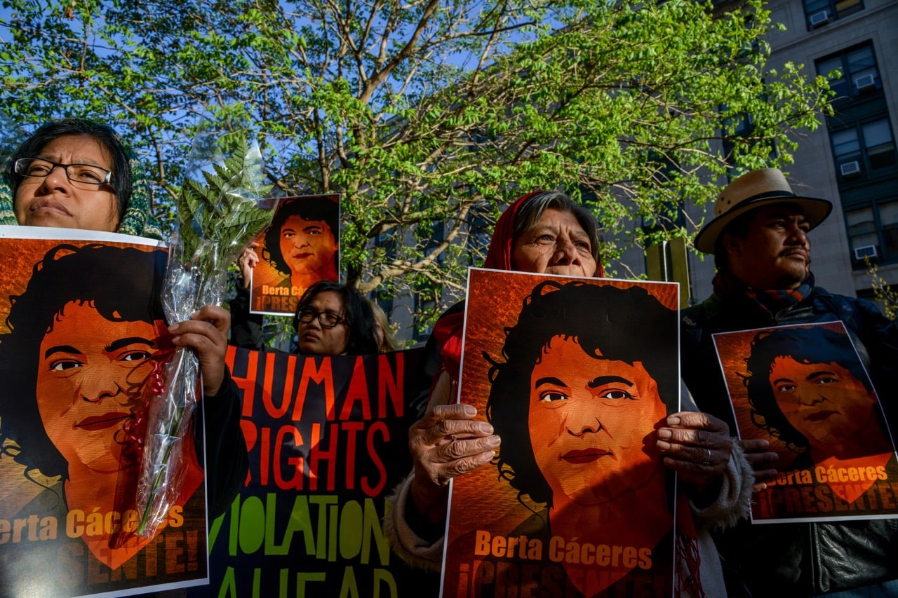 Environmental activists gather in front of the Office of American States, OAS, in honor of prominent indigenous activist Berta Caceres, in Washington, DC, 5 April 2016, Jahi Chikwendiu/The Washington Post via Getty Images