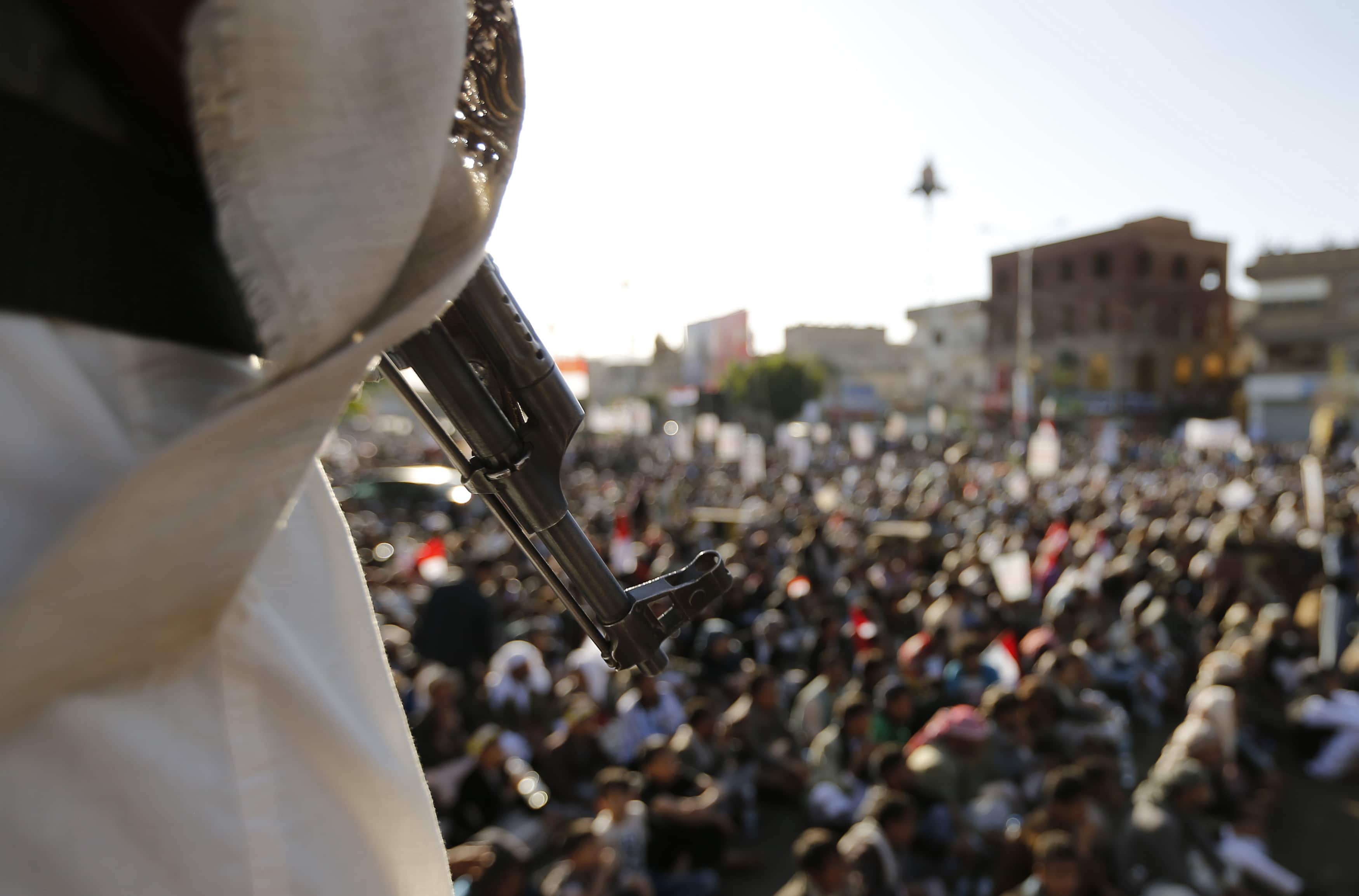 A Shi'ite Houthi holds a weapon as rebels wait for a televised speech by their leader Abdul Malik al-Houthi in Sanaa September 23, 2014, REUTERS/Khaled Abdullah