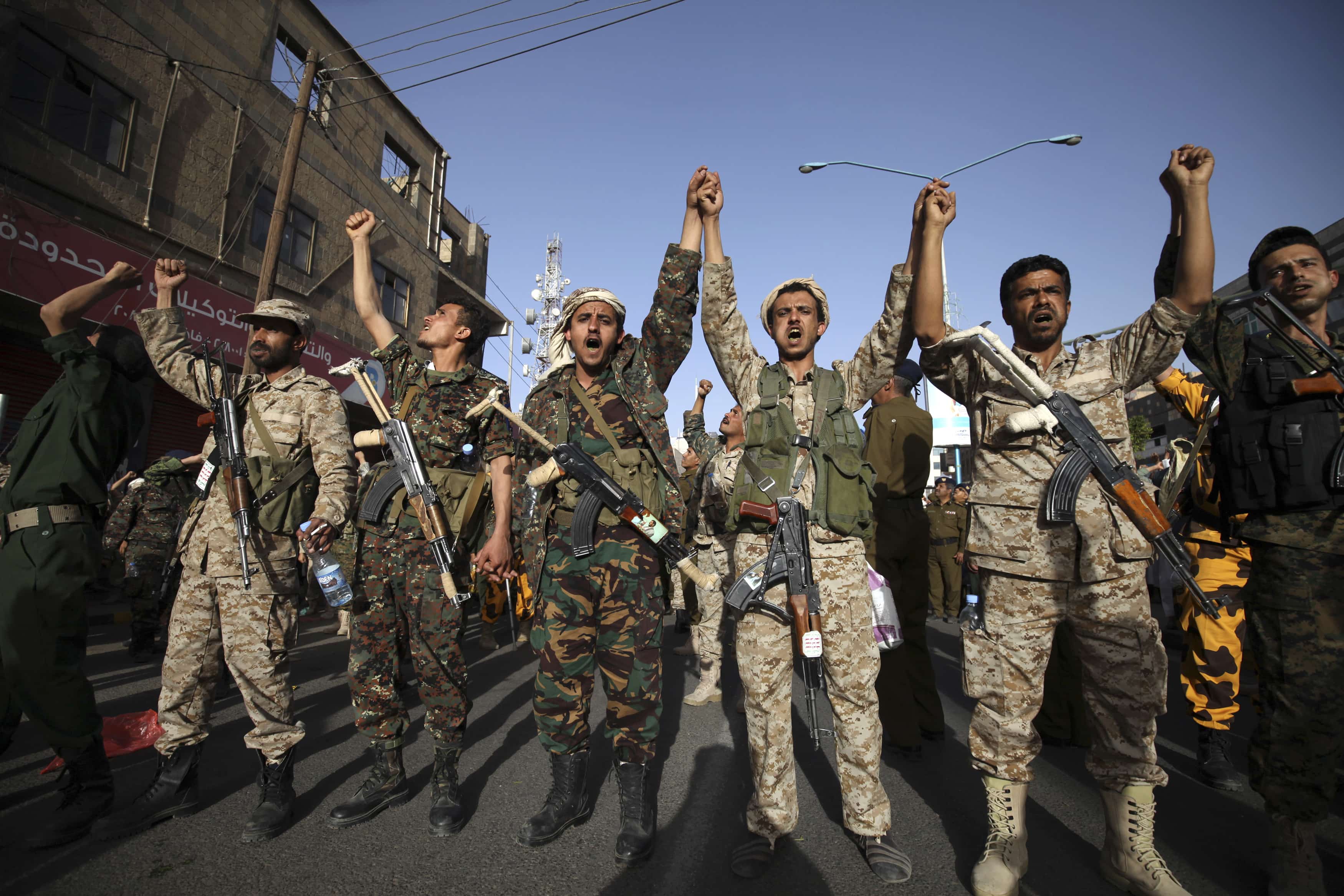 Houthi fighters in army uniform shout slogans during a demonstration to show support to the movement, and rejecting foreign interference in Yemen's internal affairs, in Sanaa on 27 February 2015, REUTERS/Mohamed al-Sayaghi