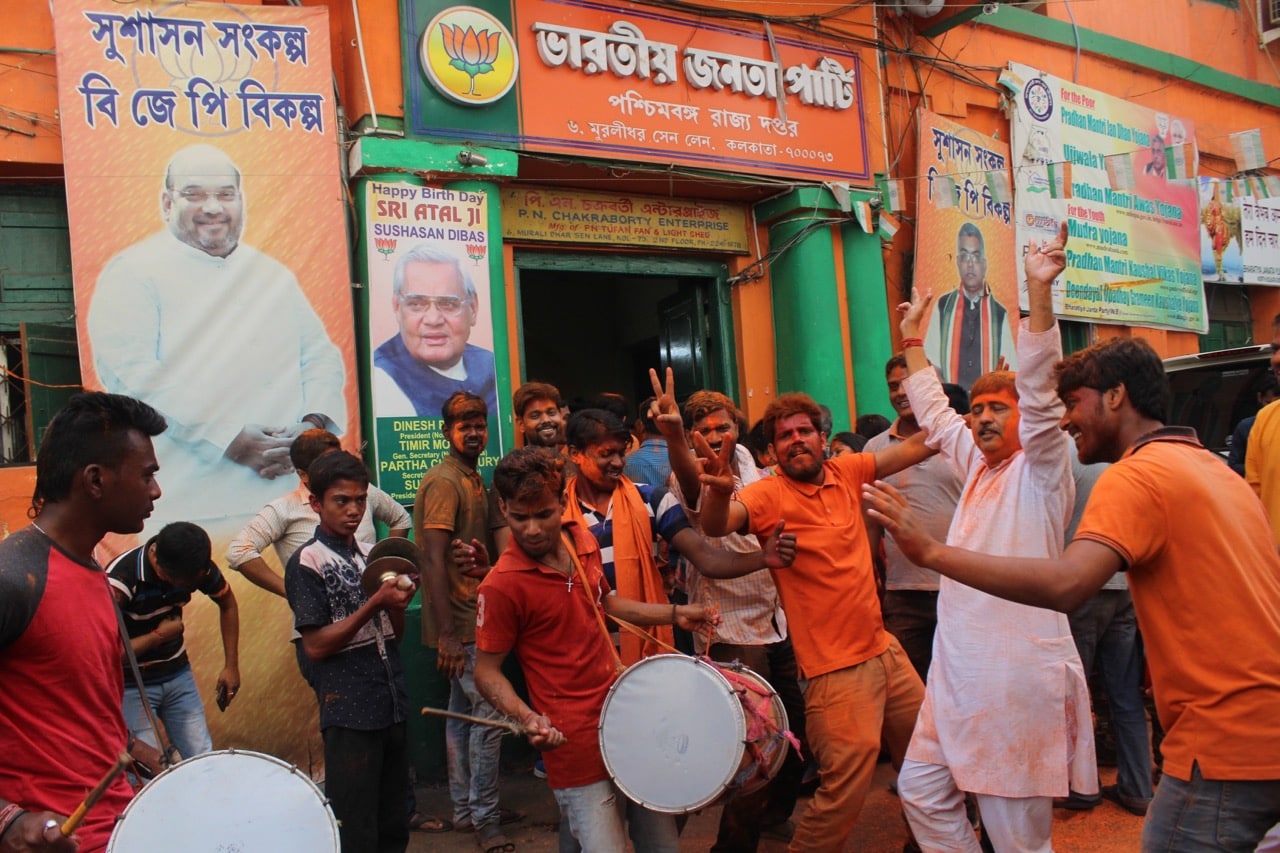 Supporters of the Bharatiya Janata Party (BJP) celebrate at a rally following state election victories, outside the BJP Political State Party Office in Kolkata, India, 3 March 2018, Debajyoti Chakraborty/NurPhoto via Getty Images