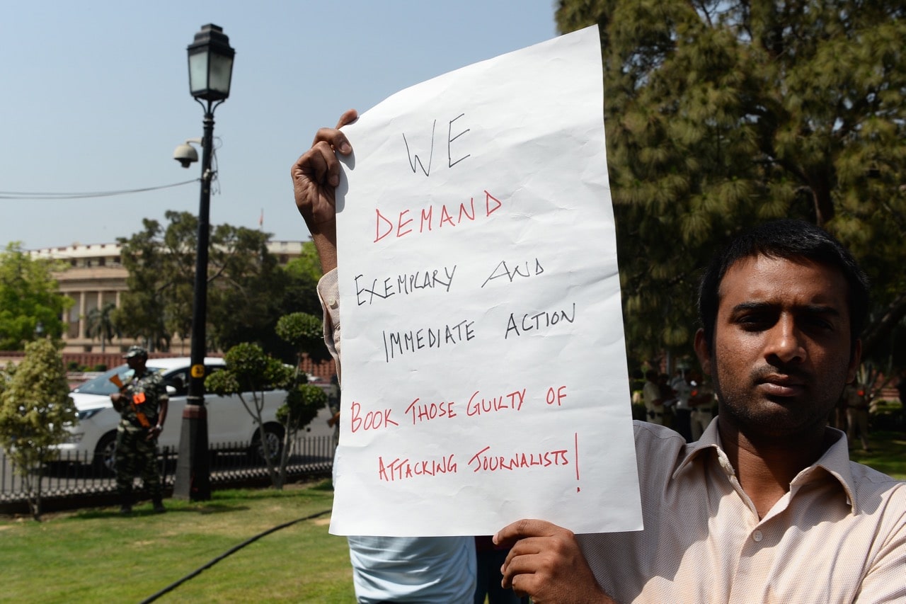 A protest near the Indian parliament over the murder of journalists following the kiling of Sandeep Sharma, in New Delhi, 27 March 2018, SAJJAD HUSSAIN/AFP/Getty Images