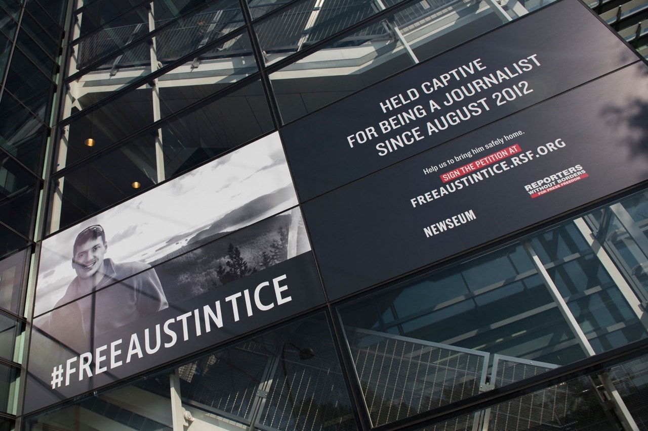 A banner calling for the release of Austin Tice, an American journalist held captive in Syria, is displayed at the Newseum in Washington, DC, 2 November 2016, ANDREW CABALLERO-REYNOLDS/AFP/Getty Images