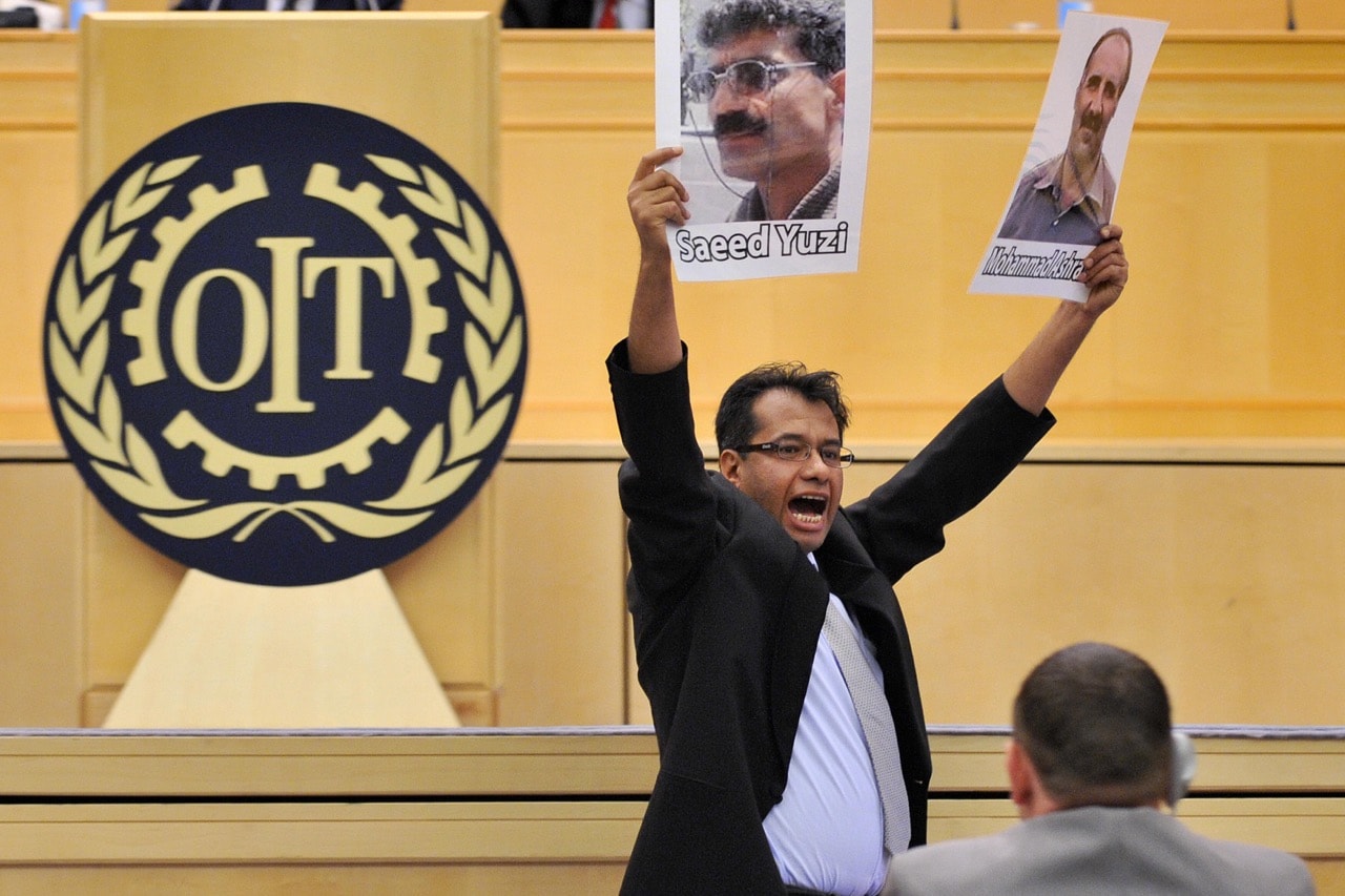 An unidentified member of the Worker Communist Party of Iran protests against the detention of the party's members at the 98th International Labour Conference at the UN offices in Geneva, 3 June 2009, FABRICE COFFRINI/AFP/Getty Images