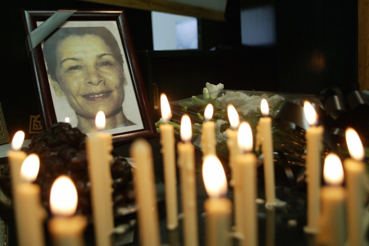 Iranian journalists light candles for the Iranian-Canadian freelance photographer Zahra Kazemi (in the photo) who died while under arrest in Tehran, 8 August 2003, BEHROUZ MEHRI/AFP/Getty Images