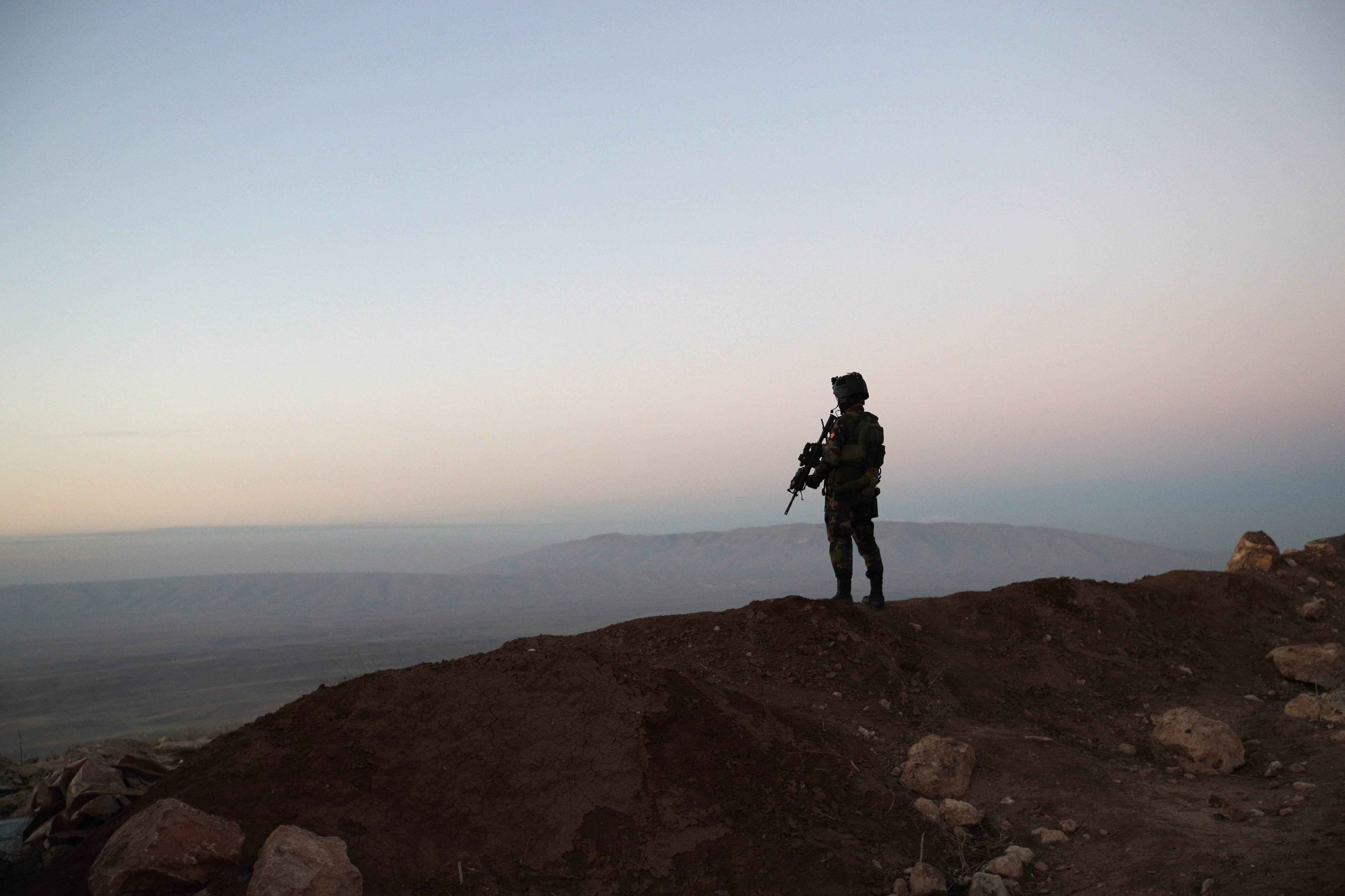 A Kurdish Peshmerga soldier is silhouetted outside the Kurdish city of Erbil, Iraq, 2 January 2017, REUTERS/Christophe Ena/Pool