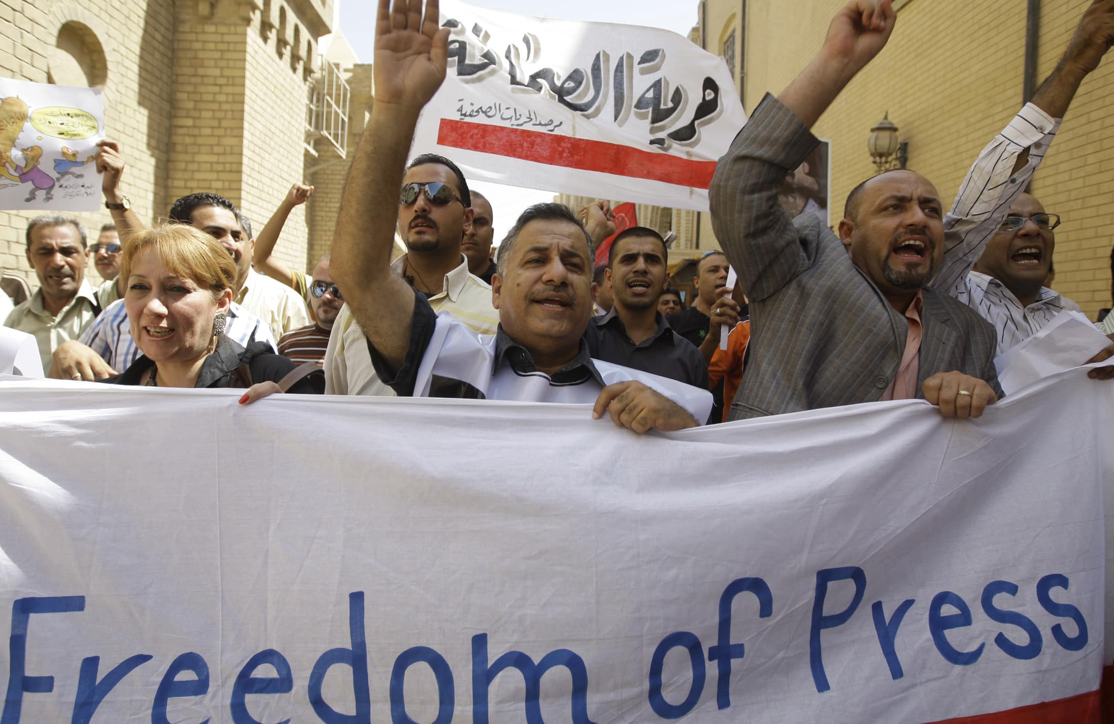 Iraq has the world's worst record on impunity, according to CPJ's Impunity index; in this photo, Iraqi protesters chant slogans in support of press freedom in 2009, REUTERS/Mohammed Ameen