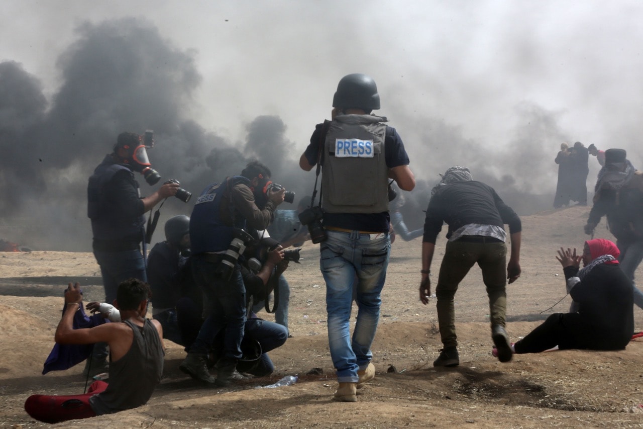 Palestinian journalists cover the demonstrations on the border with Israel, amidst concerns over the "disproportionate use of force by Israeli troops", 20 April 2018, Momen Faiz/NurPhoto via Getty Images