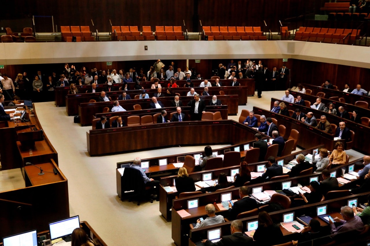 Israeli Prime Minister Benjamin Netanyahu (C-R) and MPs take part in a Knesset (parliament) session in Jerusalem, 26 December 2018, MENAHEM KAHANA/AFP/Getty Images