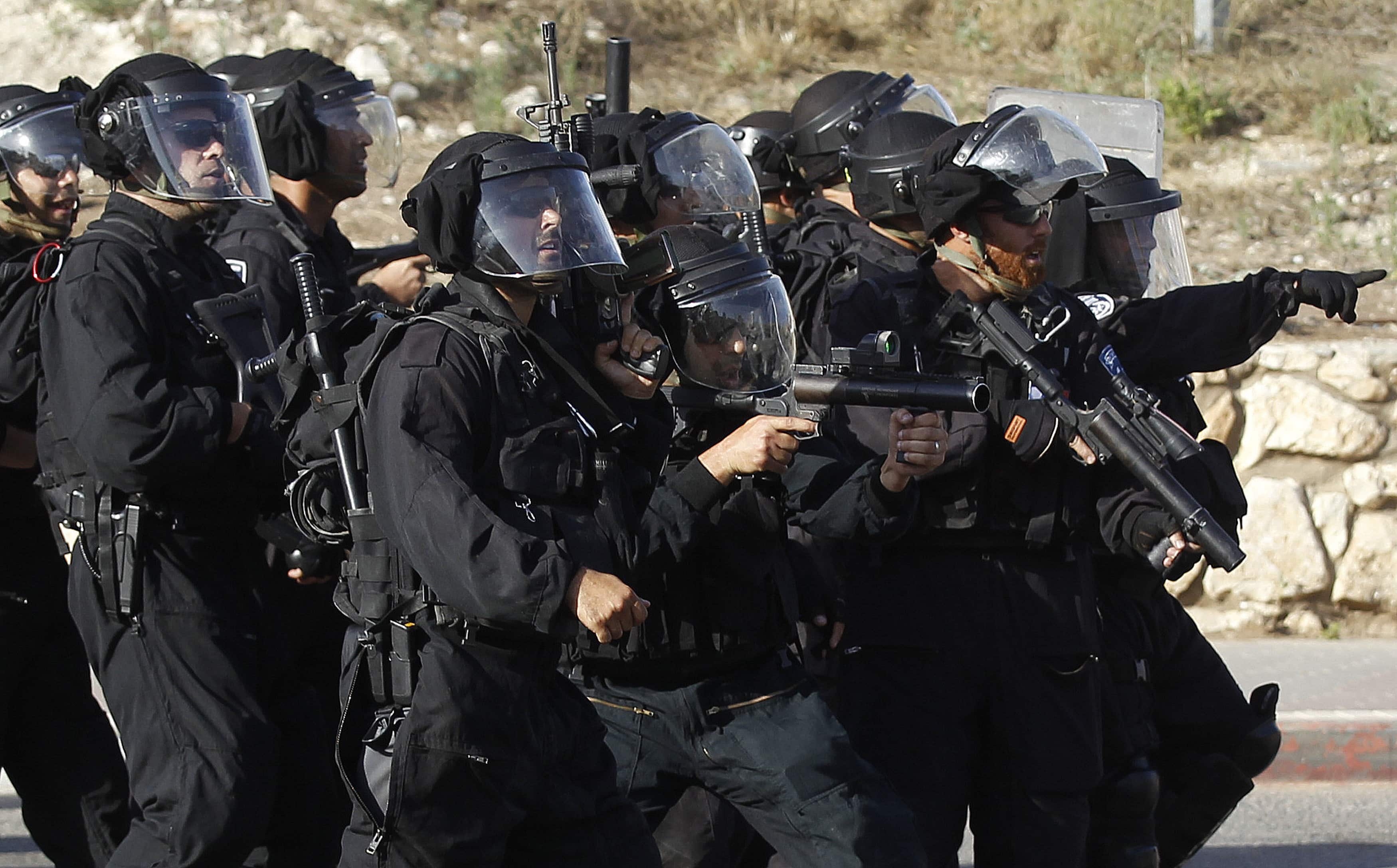 Israeli police take up positions in the Israeli-Arab town of Umm el-Fahm, during a demonstration by protesters against Israel's military operation to search for three missing Israeli teenagers in the occupied West Bank on 27 June 2014, REUTERS/Ammar Awad