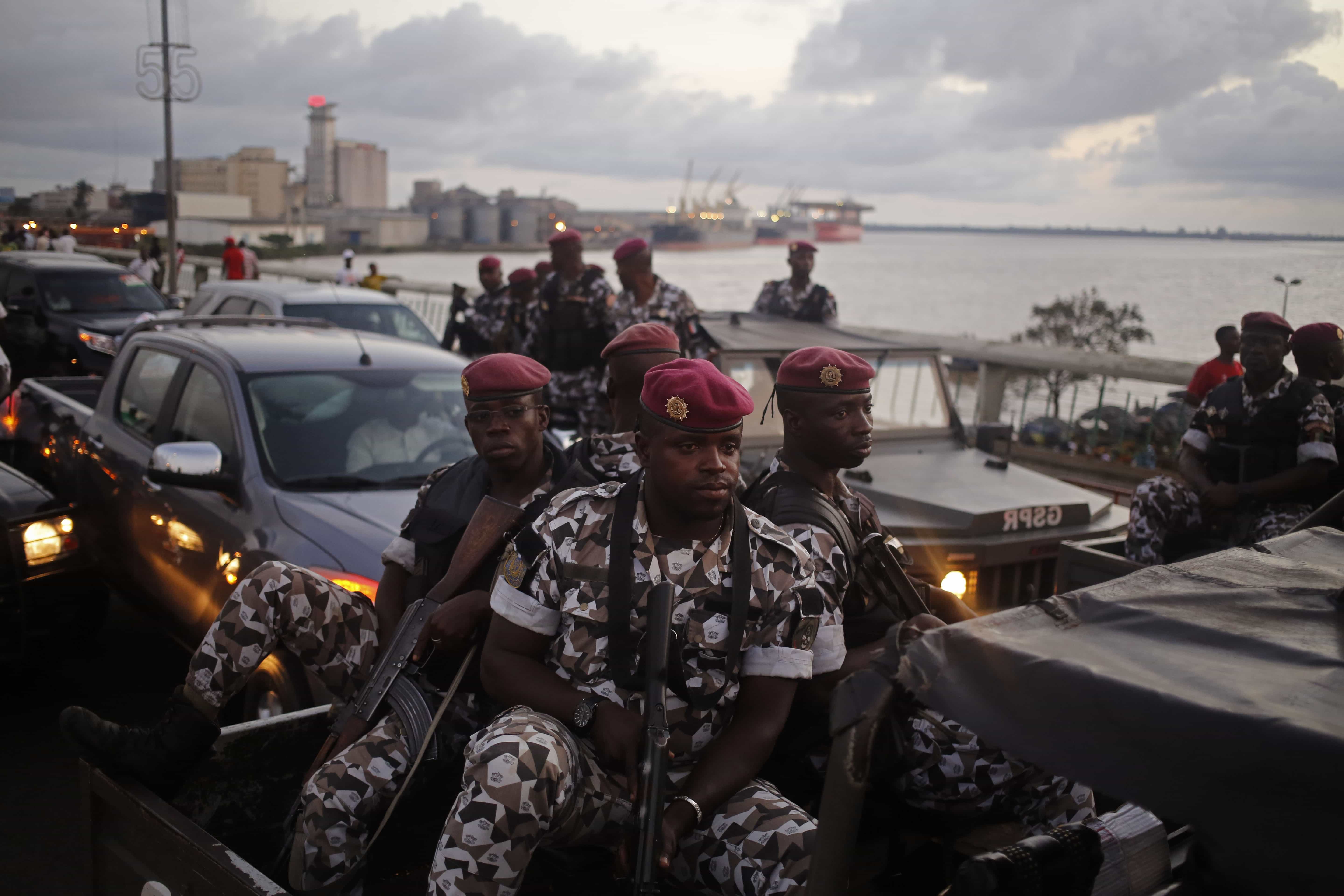 In this file photo taken on 23 October 2015, Ivory Coast troops provide security during an election rally of Ivory Coast incumbent President Alassane Ouattara in Abidjan, Ivory Coast, AP Photo/Schalk van Zuydam, File