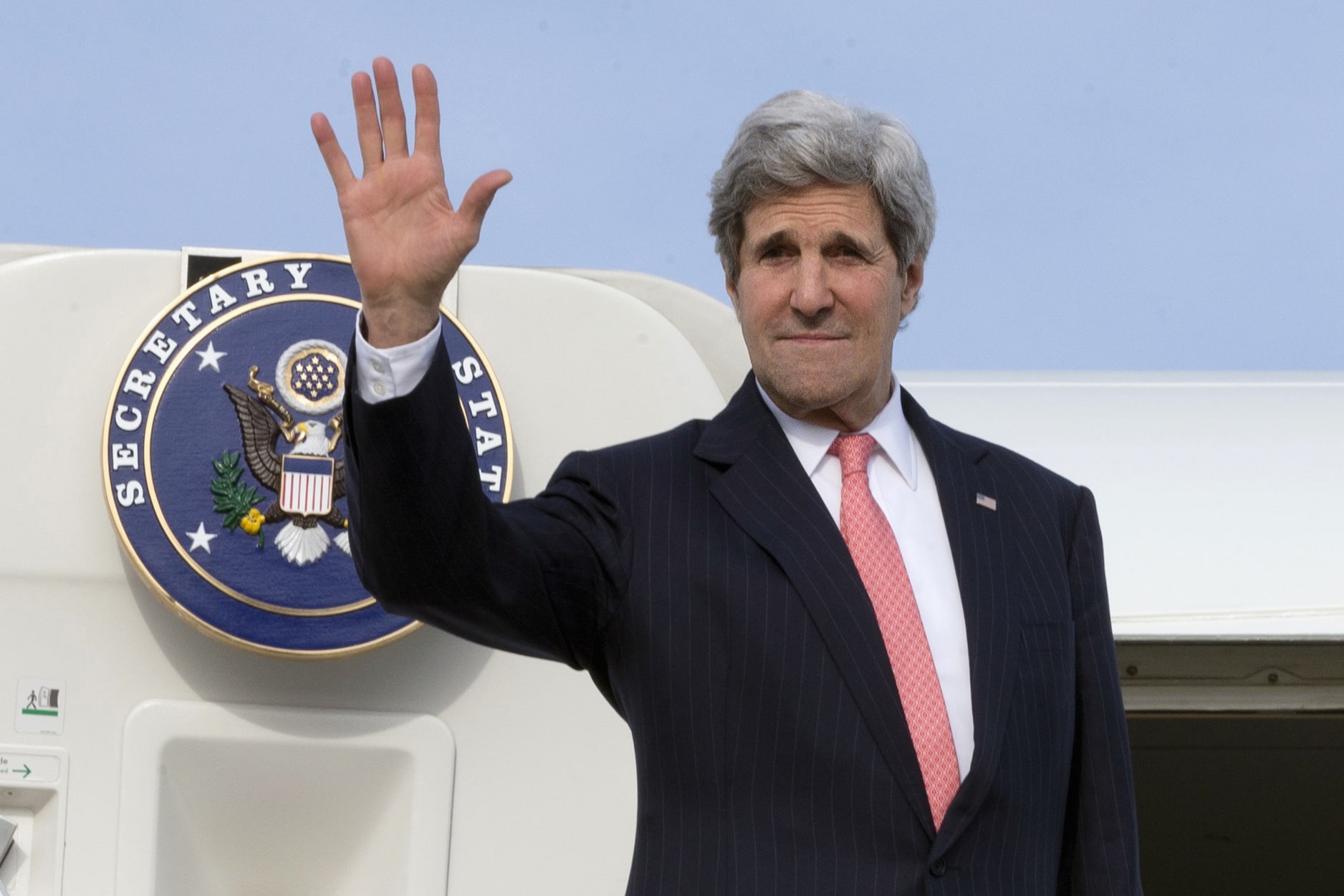 U.S. Secretary of State John Kerry waves goodbye as he leaves Brussels, to fly to Algeria on 2 April 2014, REUTERS/Jacquelyn Martin/Pool