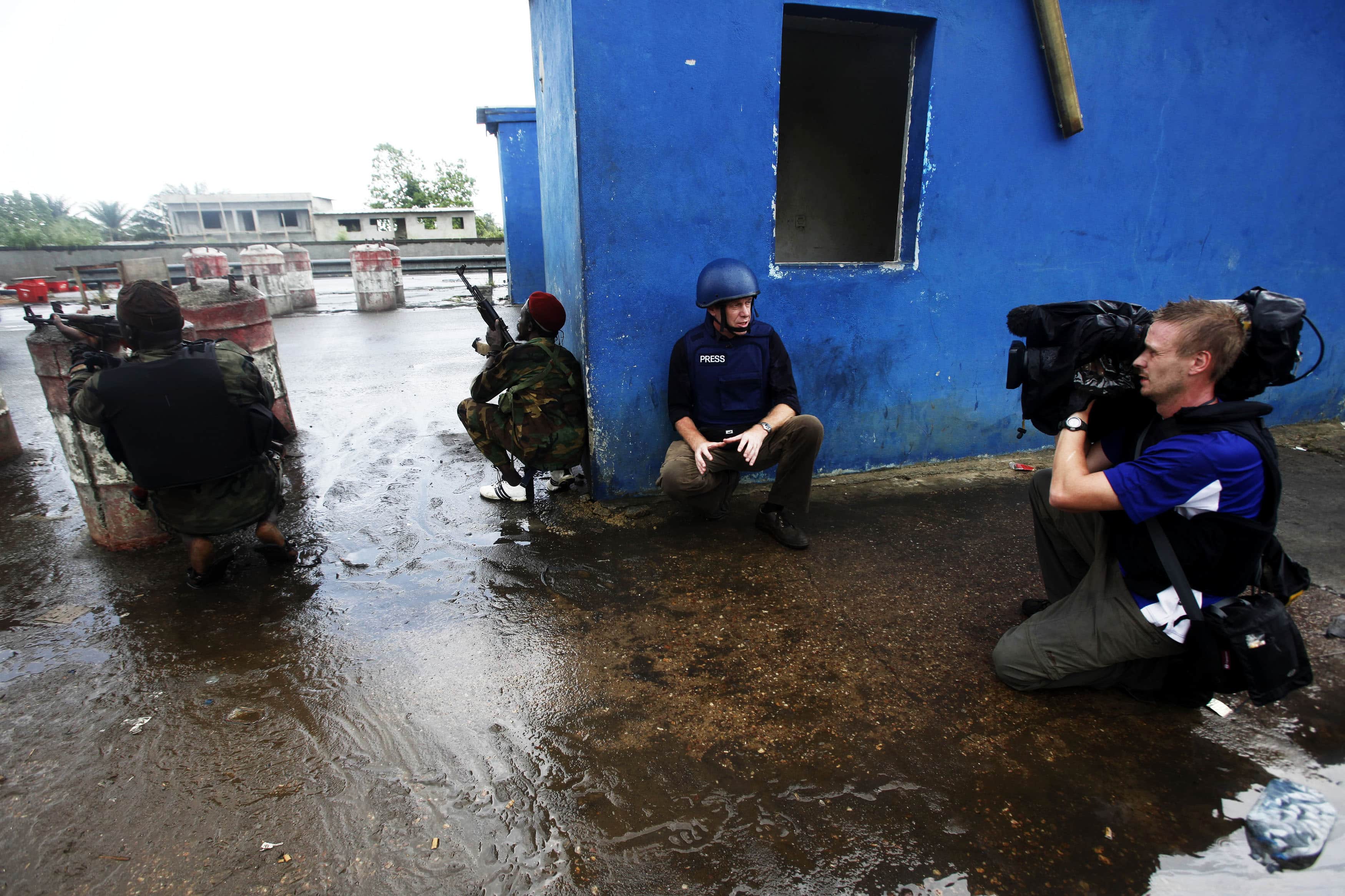 A BBC television crew reports from the front line on the northern outskirts of Ivory Coast's main city Abidjan April 8, 2011, REUTERS/Emmanuel Braun