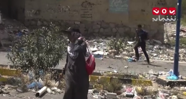 Ahmed al-Shaibani, right, trying to run for cover, as shown on a graphic YouTube video , Screen grab/Youtube