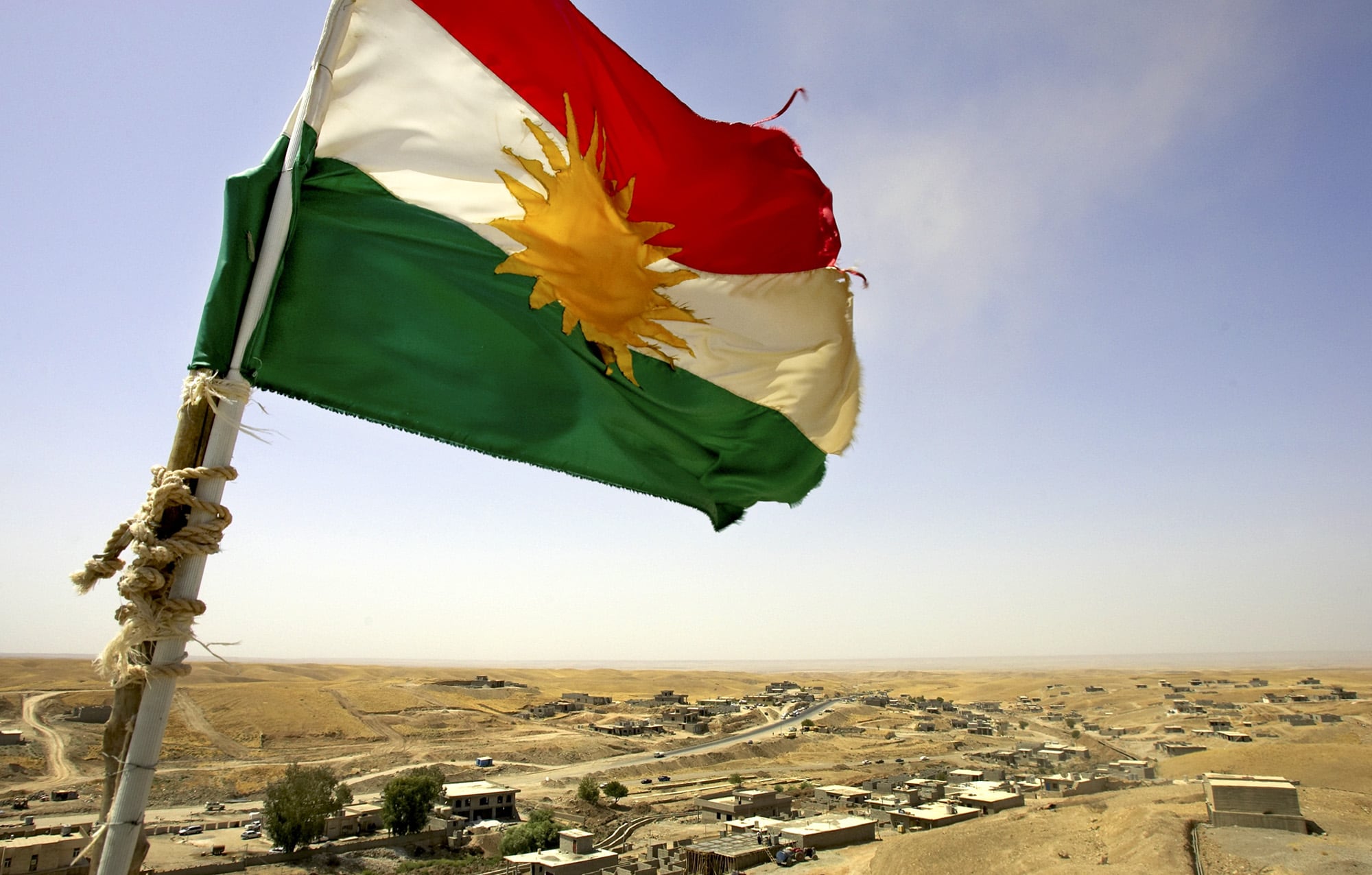 A Kurdish flag waves from the top of a watertower built by the Patriotic Union of Kurdistan political party, (AP Photo/Jacob Silberberg)