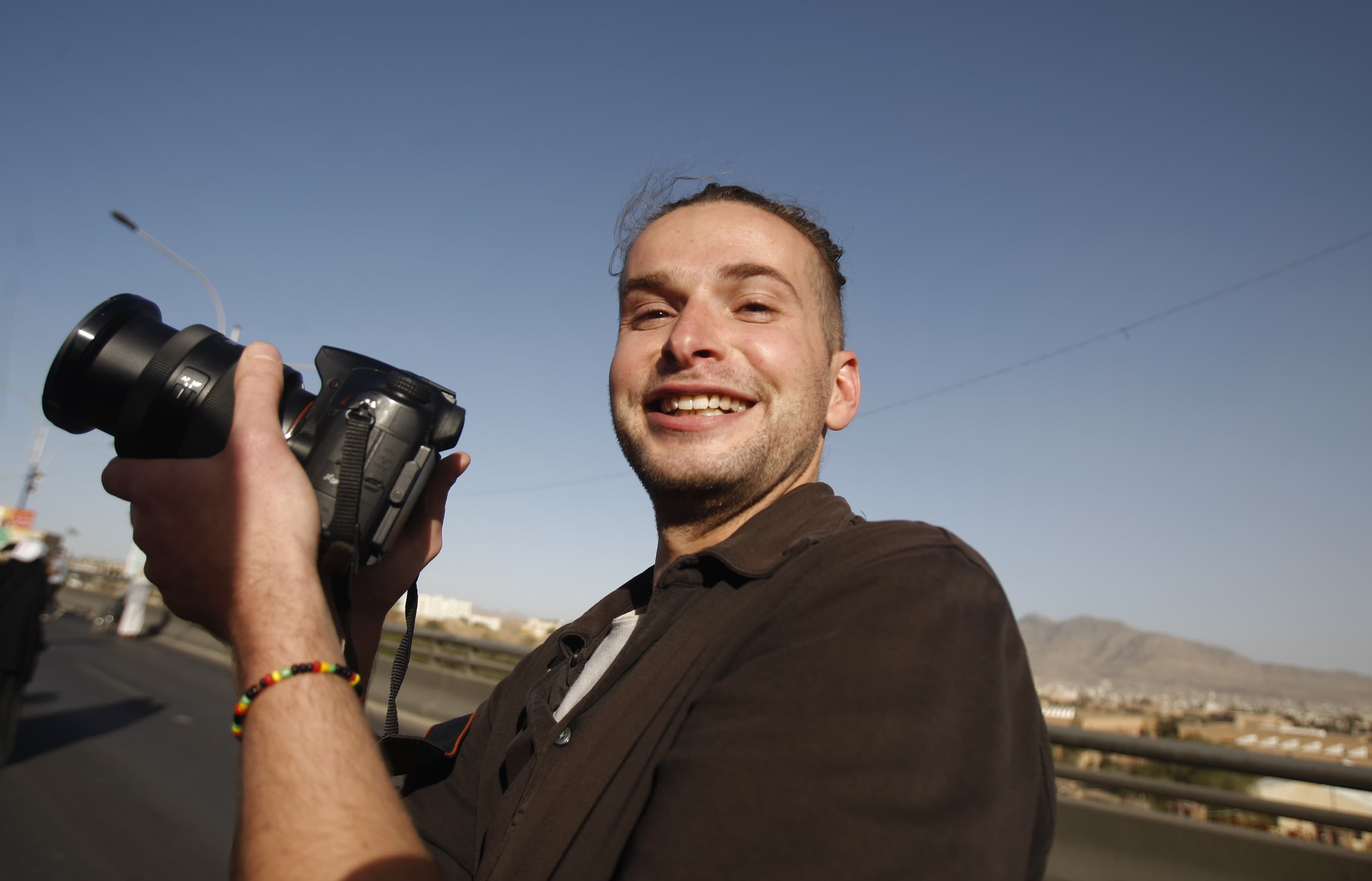 Luke Somers, 33, an American photojournalist who was kidnapped over a year ago by al-Qaida, poses for a picture during a parade marking the second anniversary of the revolution in Sanaa, Yemen, AP Photo/Hani Mohammed