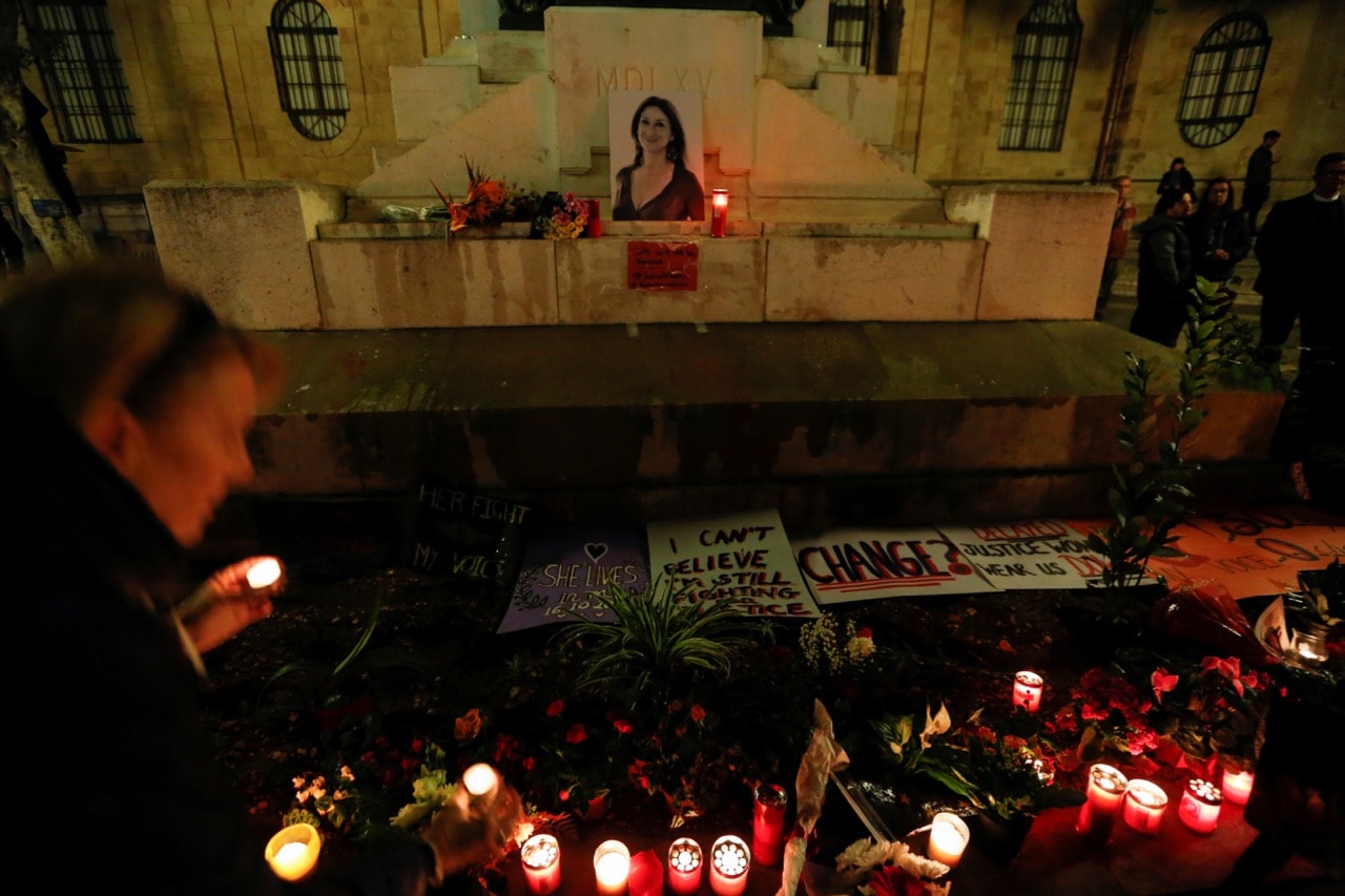 People place candles at a memorial for investigative journalist Daphne Caruana Galizia, who was murdered in a car bomb attack, during a vigil in Valletta, Malta, 16 November 2017, REUTERS/Darrin Zammit Lupi