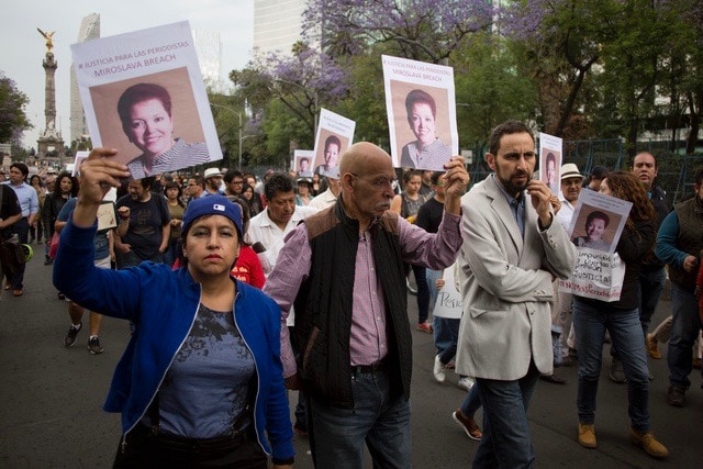 Protestors in Mexico City hold up signs demanding justice for slain journalist Miroslava Breach, Associated Press/ Eduardo Verdugo