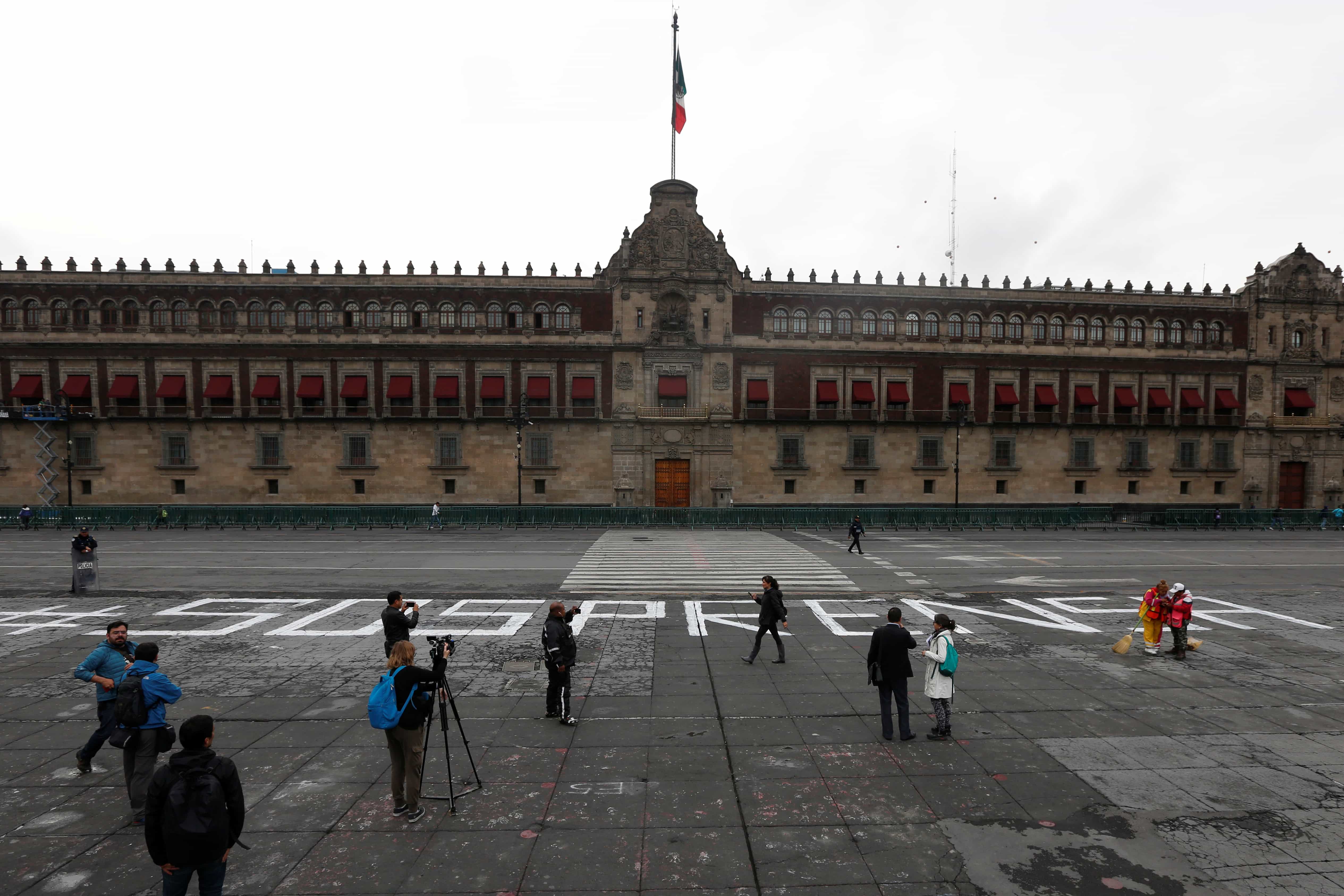 A group of journalists protests outside the National Palace for the slain journalist Salvador Adame in Mexico City, 28 June 2017; the writing reads "S.O.S Press",  REUTERS/Carlos Jasso