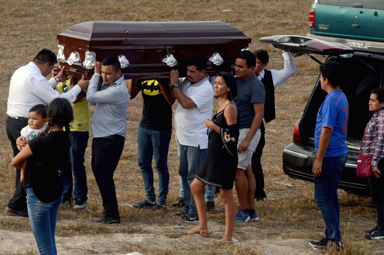 Relatives of journalist Carlos Domínguez Rodríguez carry his coffin upon arrival at the cemetery in the community of Nuxco, Guerrero state, Mexico, 17 January 2018, FRANCISCO ROBLES/AFP/Getty Images