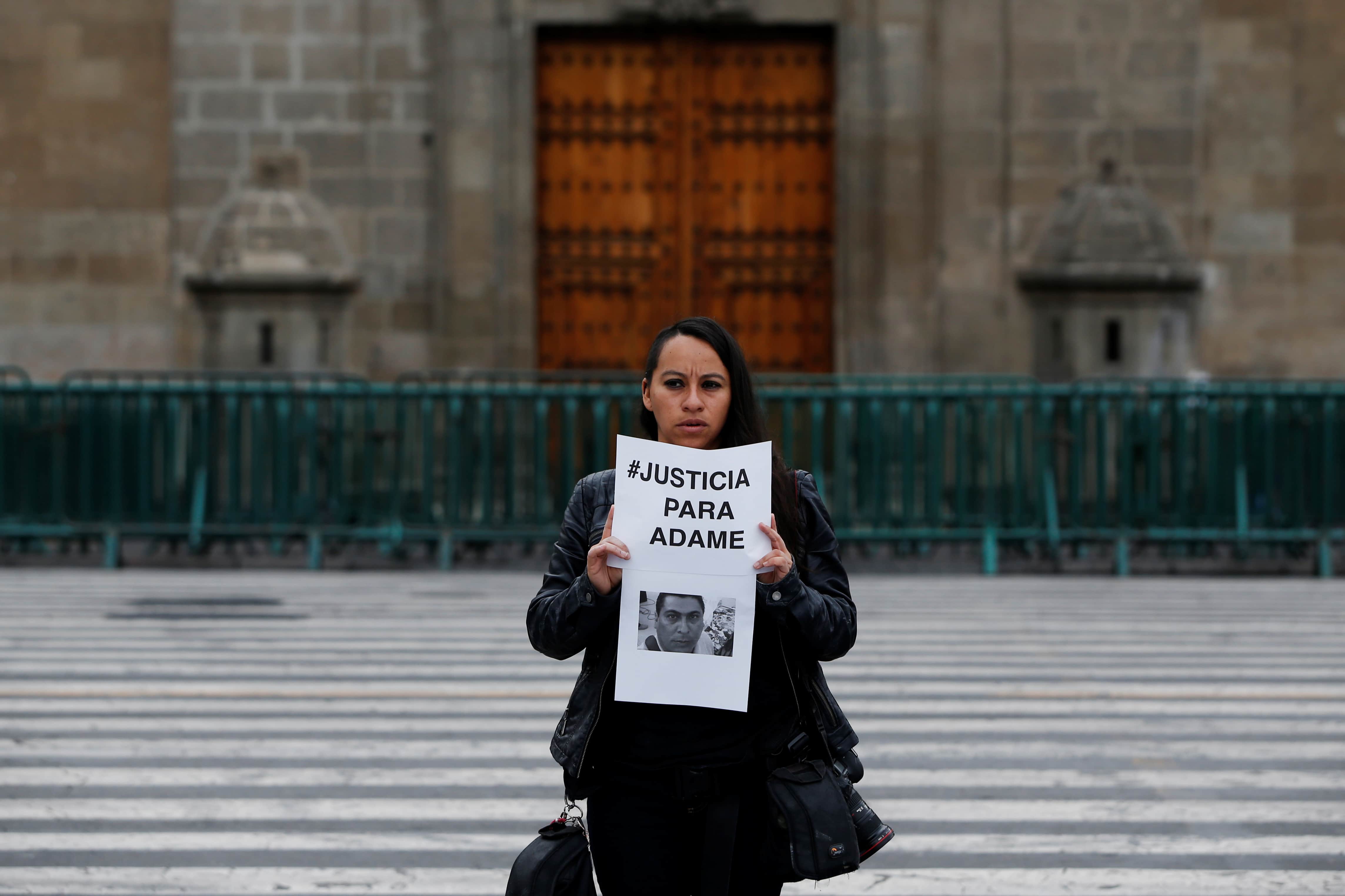 A journalist holds a placard during a protest outside the National Palace for the slain journalist Salvador Adame in Mexico City, Mexico, 28 June 2017. Placard reads "Justice for Adame", REUTERS/Carlos Jasso