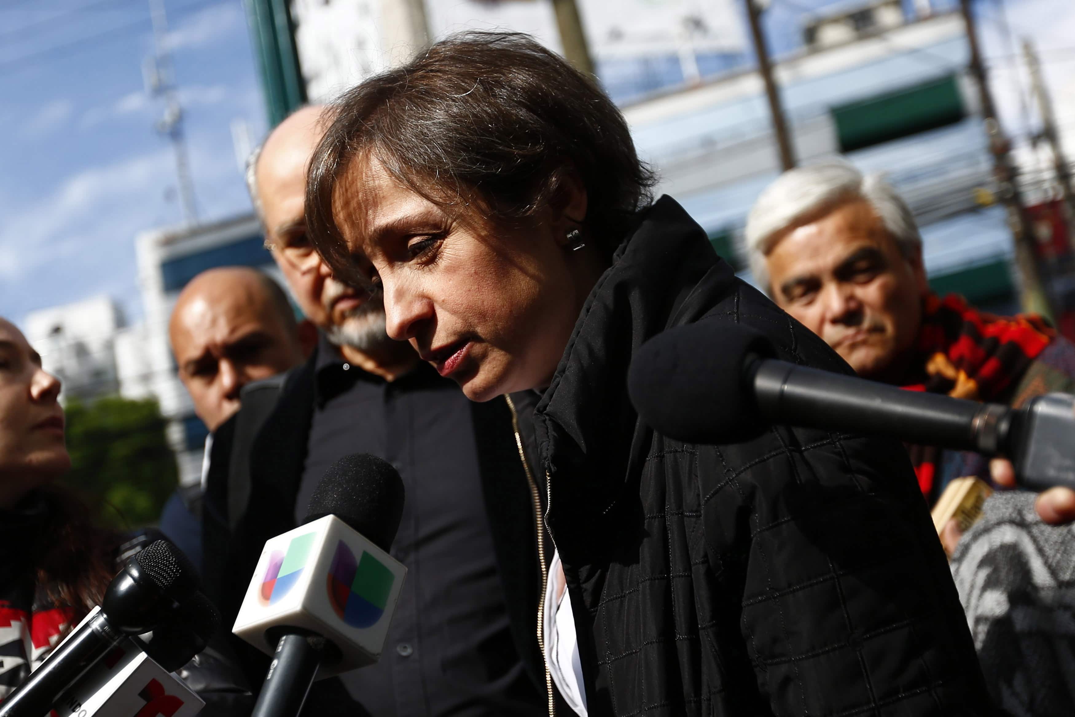 Recently-fired Mexican journalist Carmen Aristegui speaks with journalists outside MVS radio station in Mexico City, REUTERS/Edgard Garrido