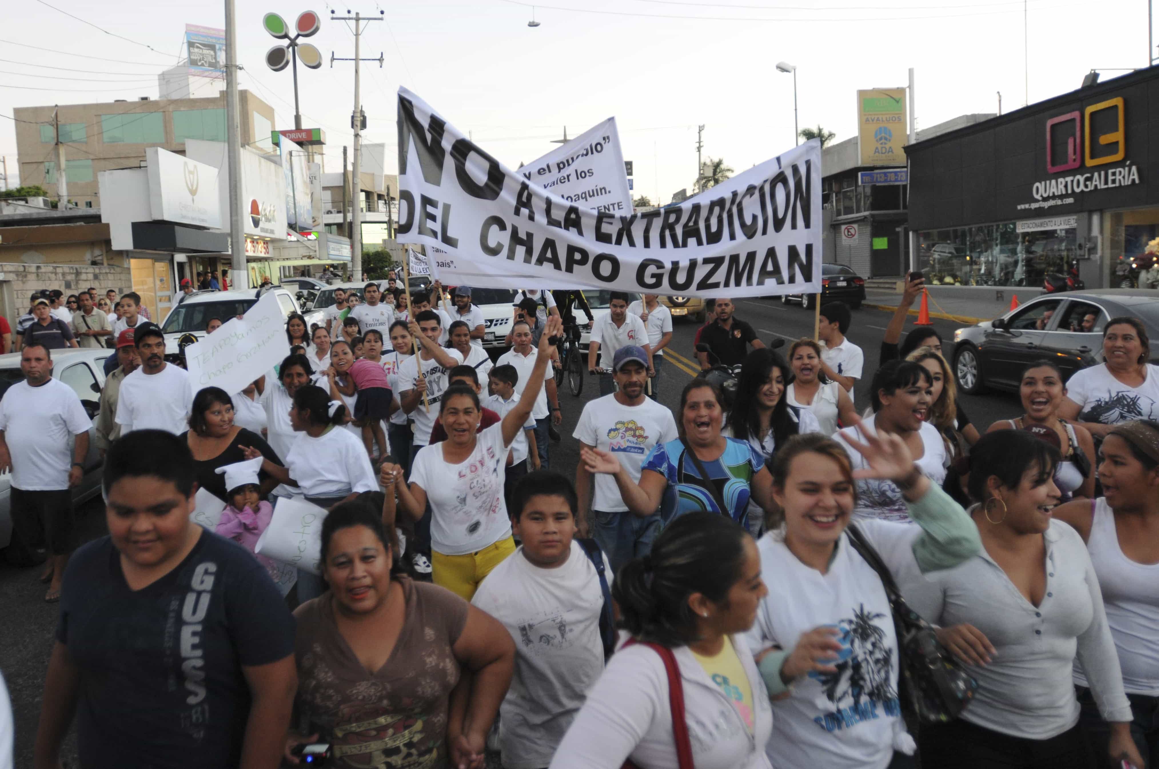 In this Feb. 26, 2014 file photo, people march in support of jailed drug boss Joaquin Guzman, "El Chapo" in the city of Culiacán, Mexico, AP Photo/El Debate de Culiacan, Jonathan Telles