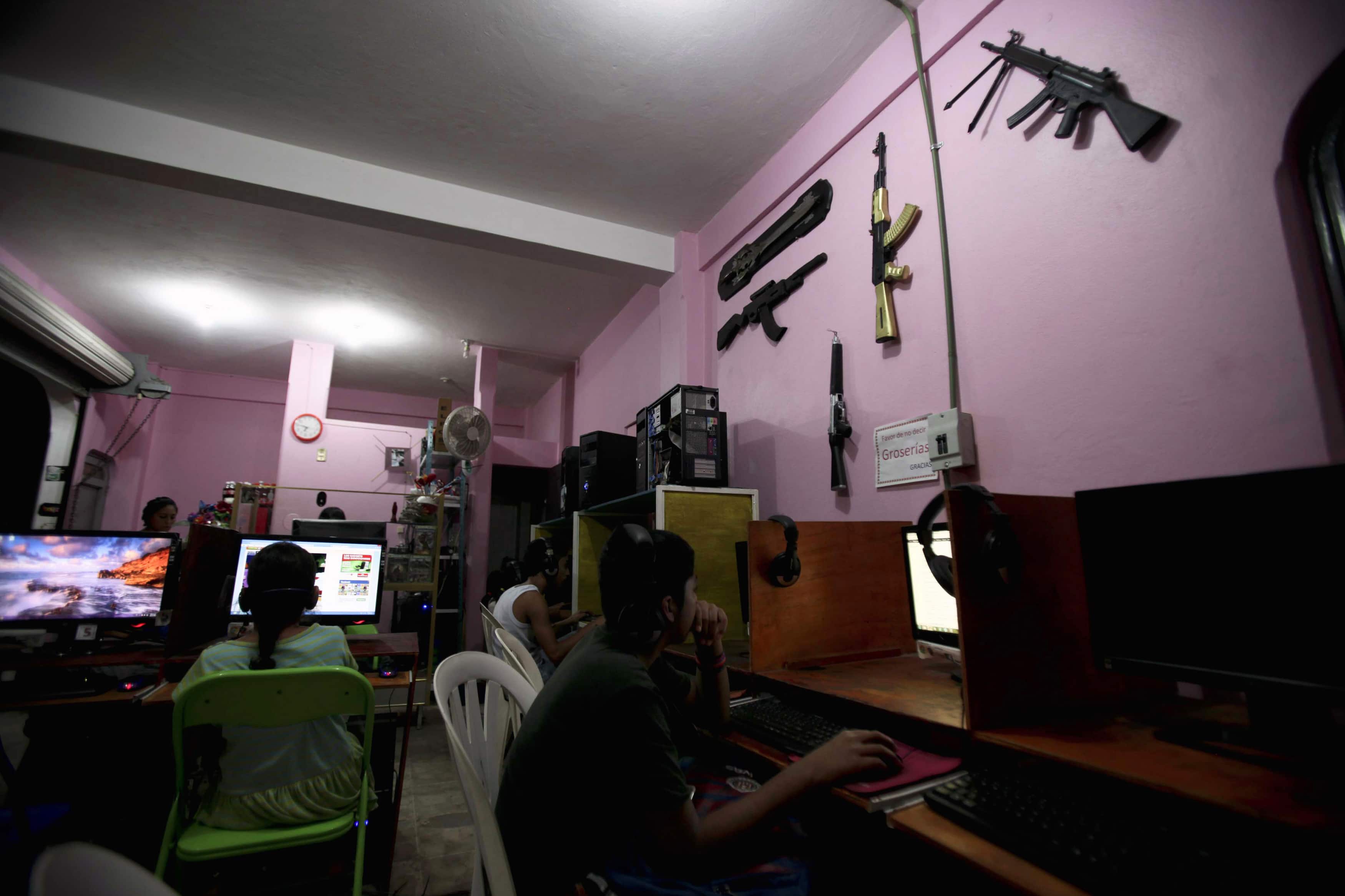 Plastic weapons hang from the walls of an internet cafe in the town of Ayutla de los Libres, in the Costa Chica (small coast) region of the southern state of Guerrero, 26 January 2013, REUTERS/Camilo Martinez