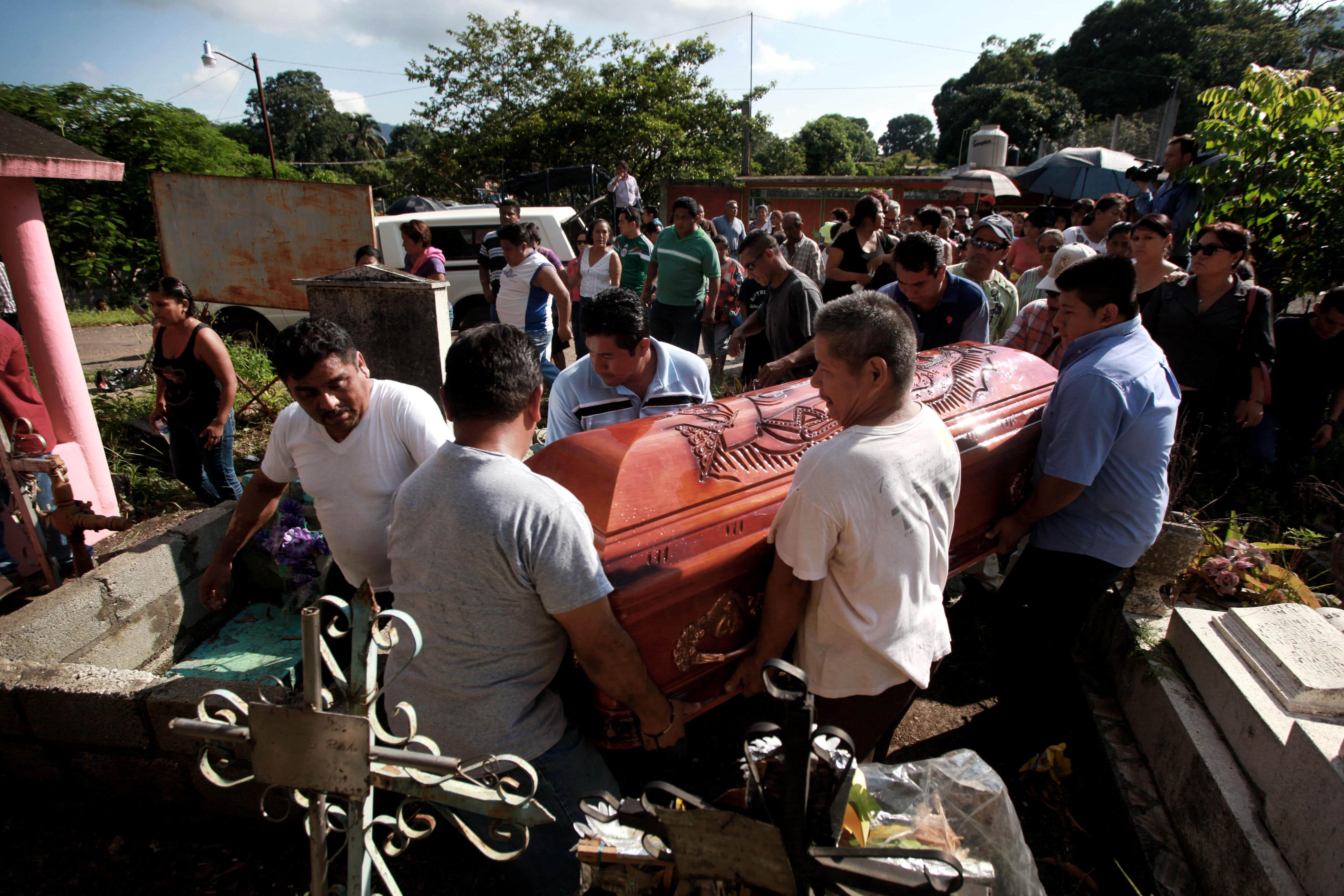 The funeral of journalist Octavio Rojas in Tezonapa, Mexico, Aug. 12, 2014. Rojas was the 10th journalist killed during the Peña Nieto administration, AP Photo/Felix Marquez