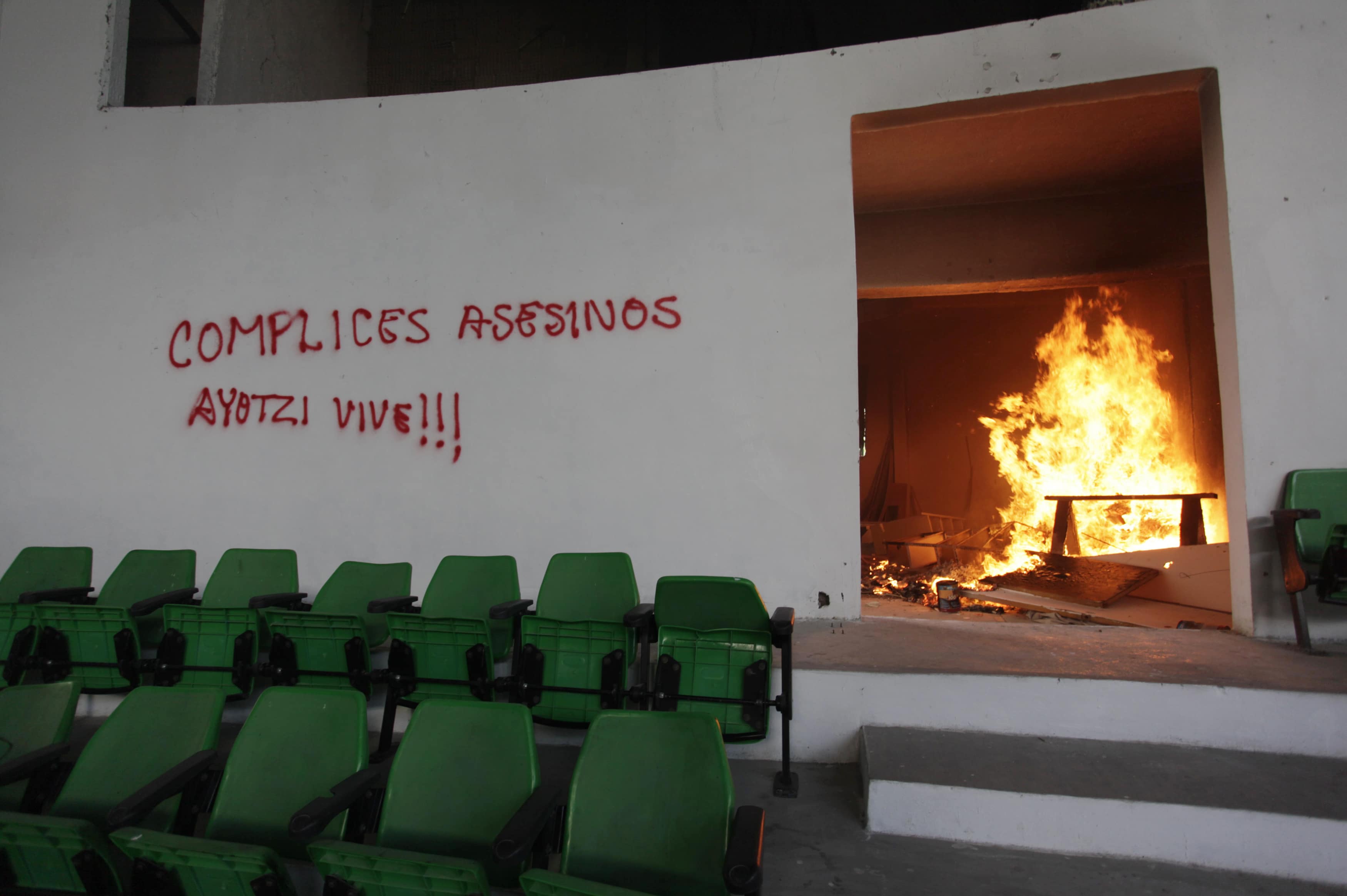 A fire burns inside the building of Mexican President Enrique Pena Nieto's PRI (Institutional Revolutionary Party) political party during protests over the 43 missing trainee teachers in Chilpancingo, REUTERS/Daniel Becerril