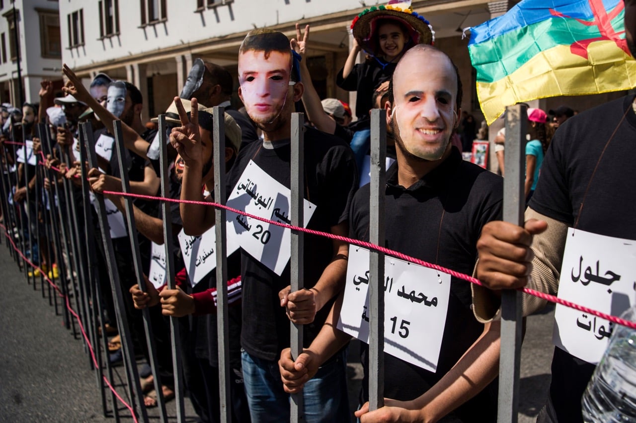 Demonstrators wearing masks protest against the jailing of the leaders of the Hirak movement, in Rabat, Morocco, 15 July 2018, FADEL SENNA/AFP/Getty Images