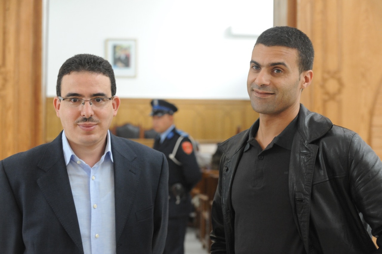 Taoufik Bouachrine, director of the "Akhbar Al Youm" newspaper, and caricaturist Khalid Gueddar arrive at the court in Casablanca, Morocco, 23 October 2009, ABDELHAK SENNA/AFP/Getty Images