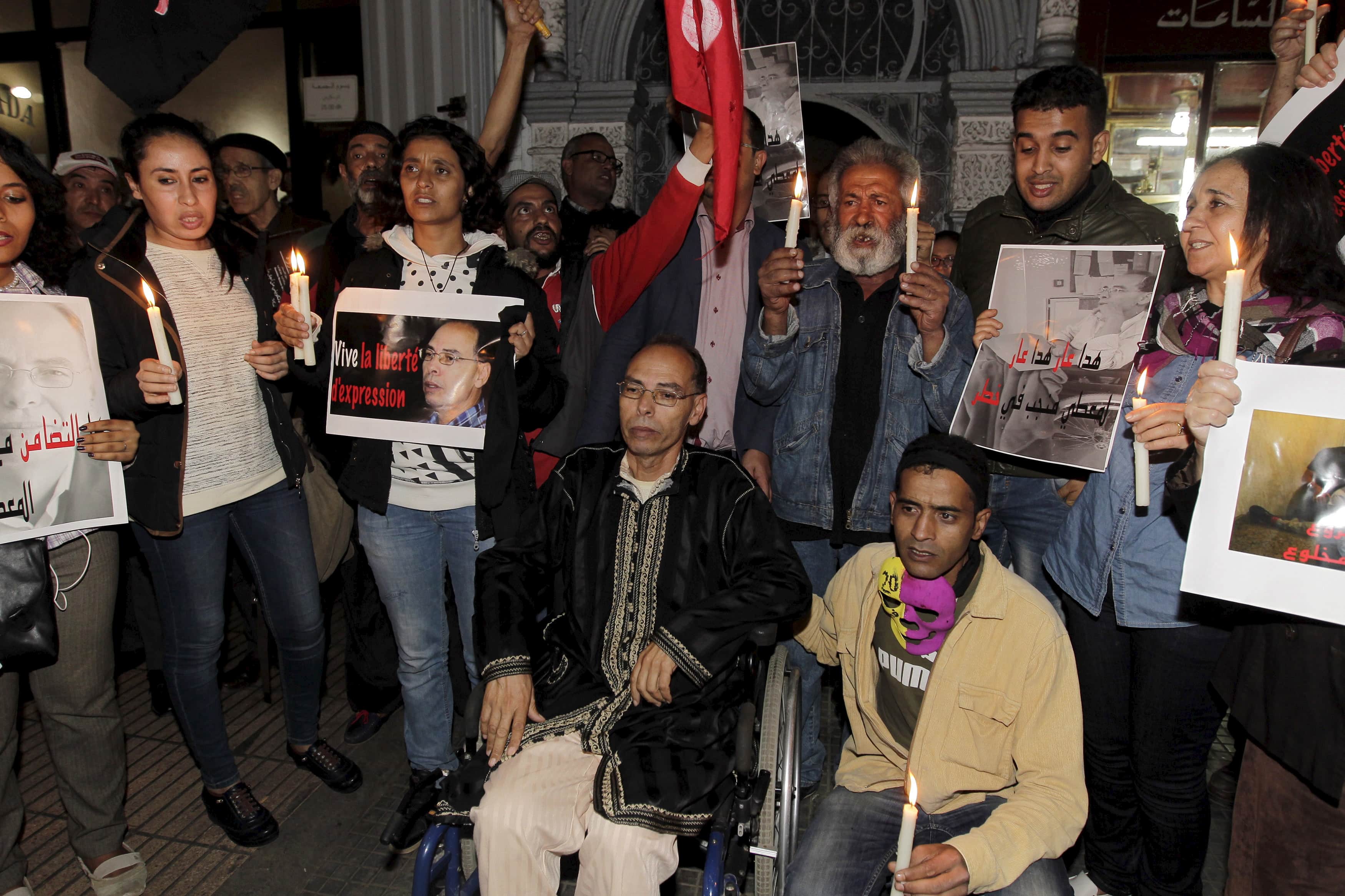 Maati Monjib (centre L), one of seven journalists and writers on trial for charges of “undermining state security”,  and his supporters participates in a demonstration near the Moroccan Human Rights Association in Rabat October 28, 2015, REUTERS/Stringer