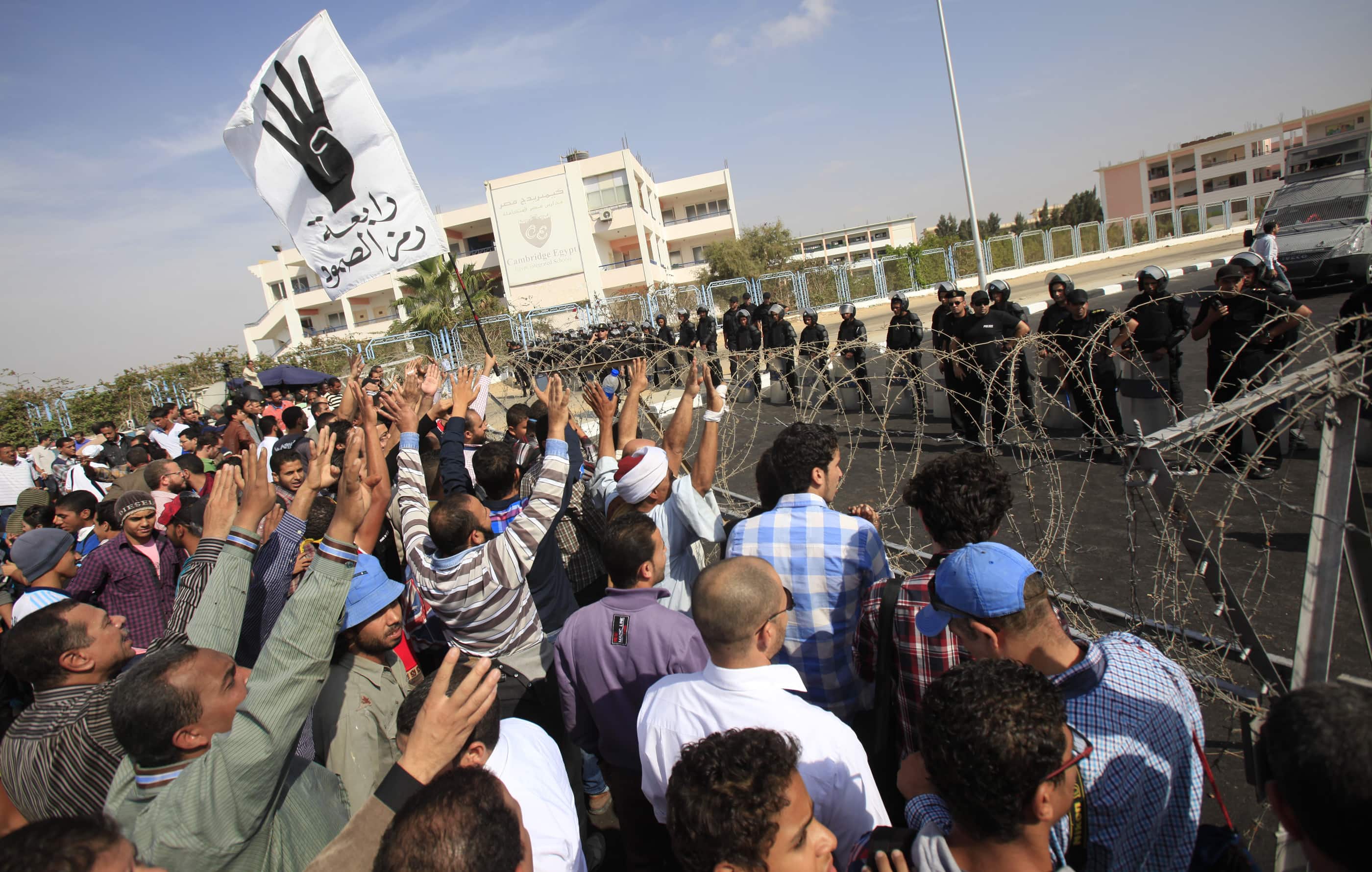 Supporters of the Muslim Brotherhood shout slogans against the military during a protest outside the police academy, where ousted Egyptian President Mohamed Mursi's trial took place on 4 November 2013, REUTERS/Amr Abdallah Dalsh