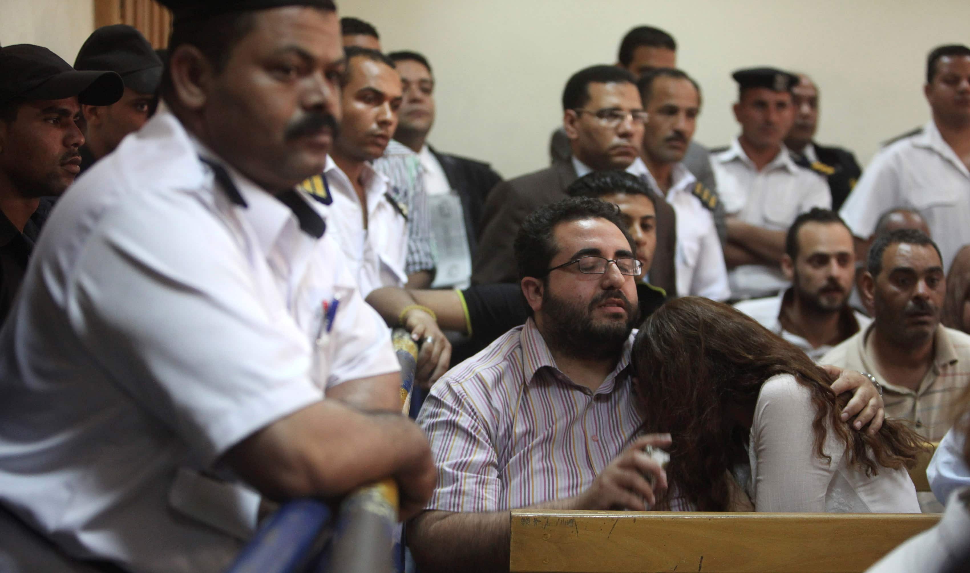 The defendants' friends react to the judge's verdict during foreign NGOs case on 4 June, REUTERS/Asmaa Waguih