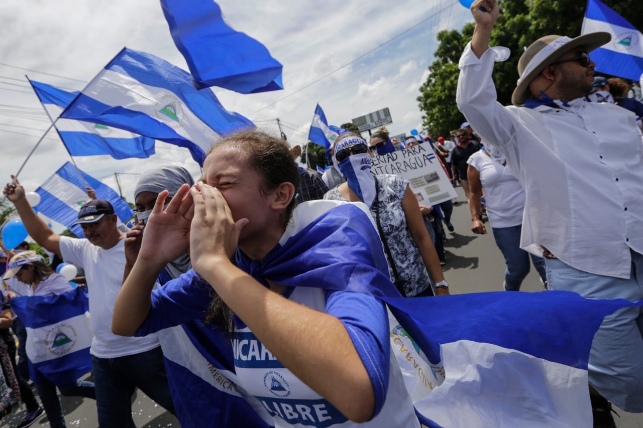 Demonstrators shout slogans during a protest against Nicaraguan President Daniel Ortega's government in Managua, 15 September 2018, INTI OCON/AFP/Getty Images