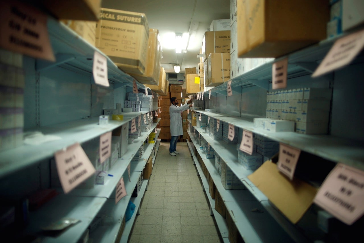 An employee checks medicines at a medicine warehouse run by the Ministry of Health, in Gaza City, 3 April 2017, REUTERS/Mohammed Salem