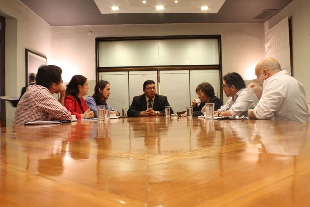 Members of the IFEX-ALC delegation speak with the Interior Minister, Francisco José De Vargas (centre), during their visit to Paraguay, IFEX-ALC