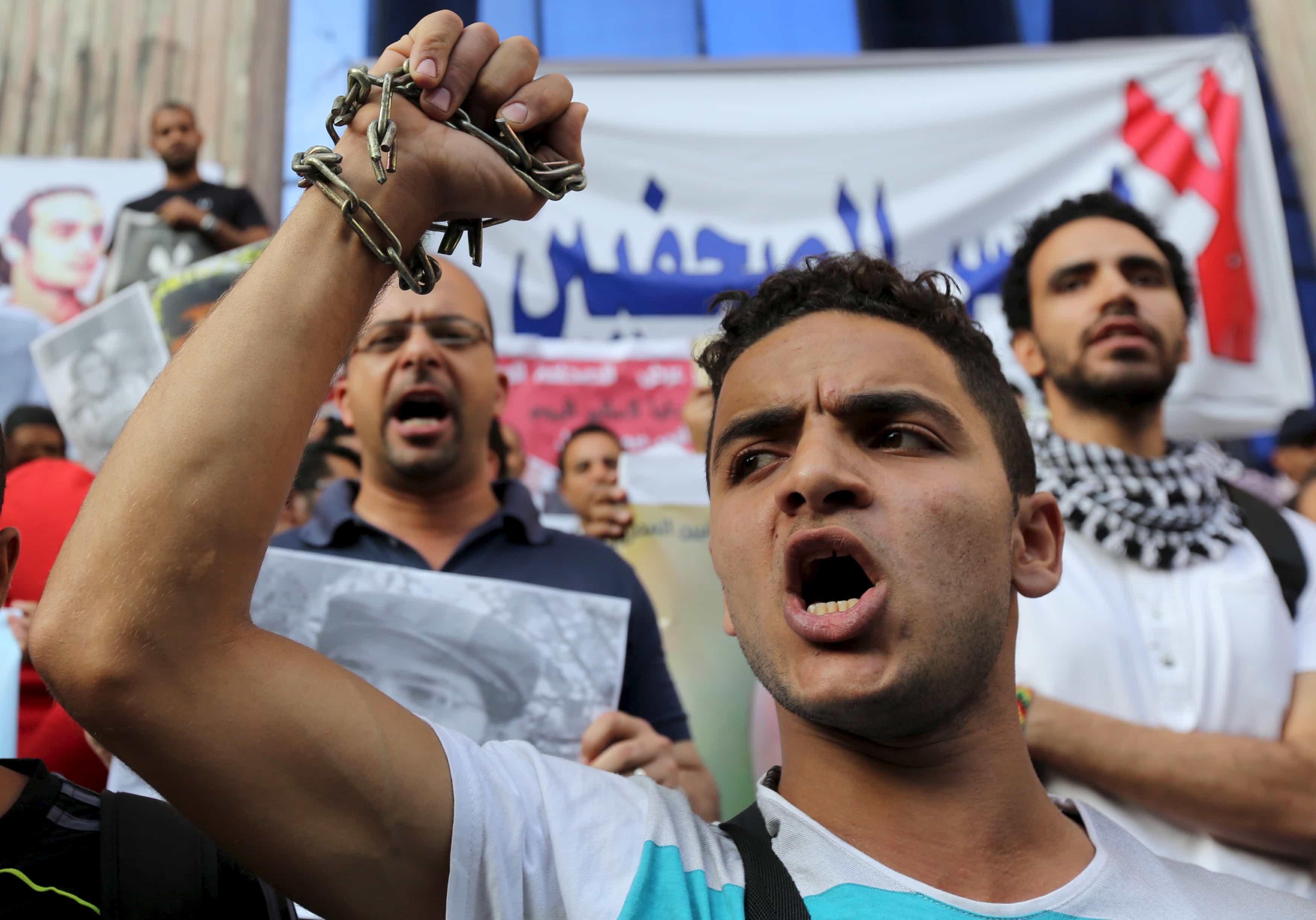 Journalists and members of the April 6 movement protest against the restriction of press freedom and demand the release of detained journalists in front of the Press Syndicate in Cairo June 10, 2015., Mohamed Abd El Ghany/Reuters