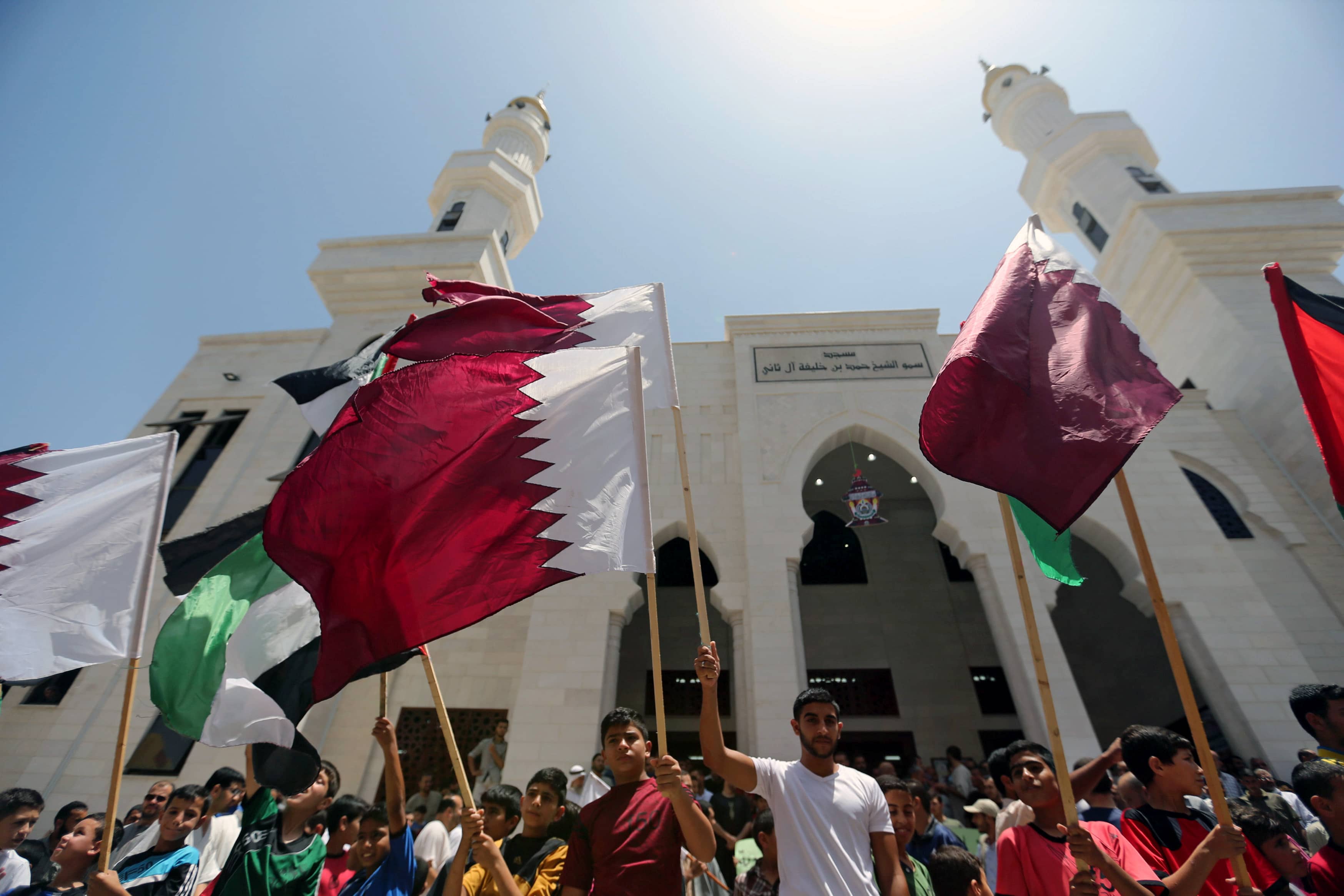 Palestinians take part in a rally in support of Qatar, inside the Qatari-funded construction project 'Hamad City', in the southern Gaza Strip, 9 June 2017, REUTERS/Ibraheem Abu Mustafa