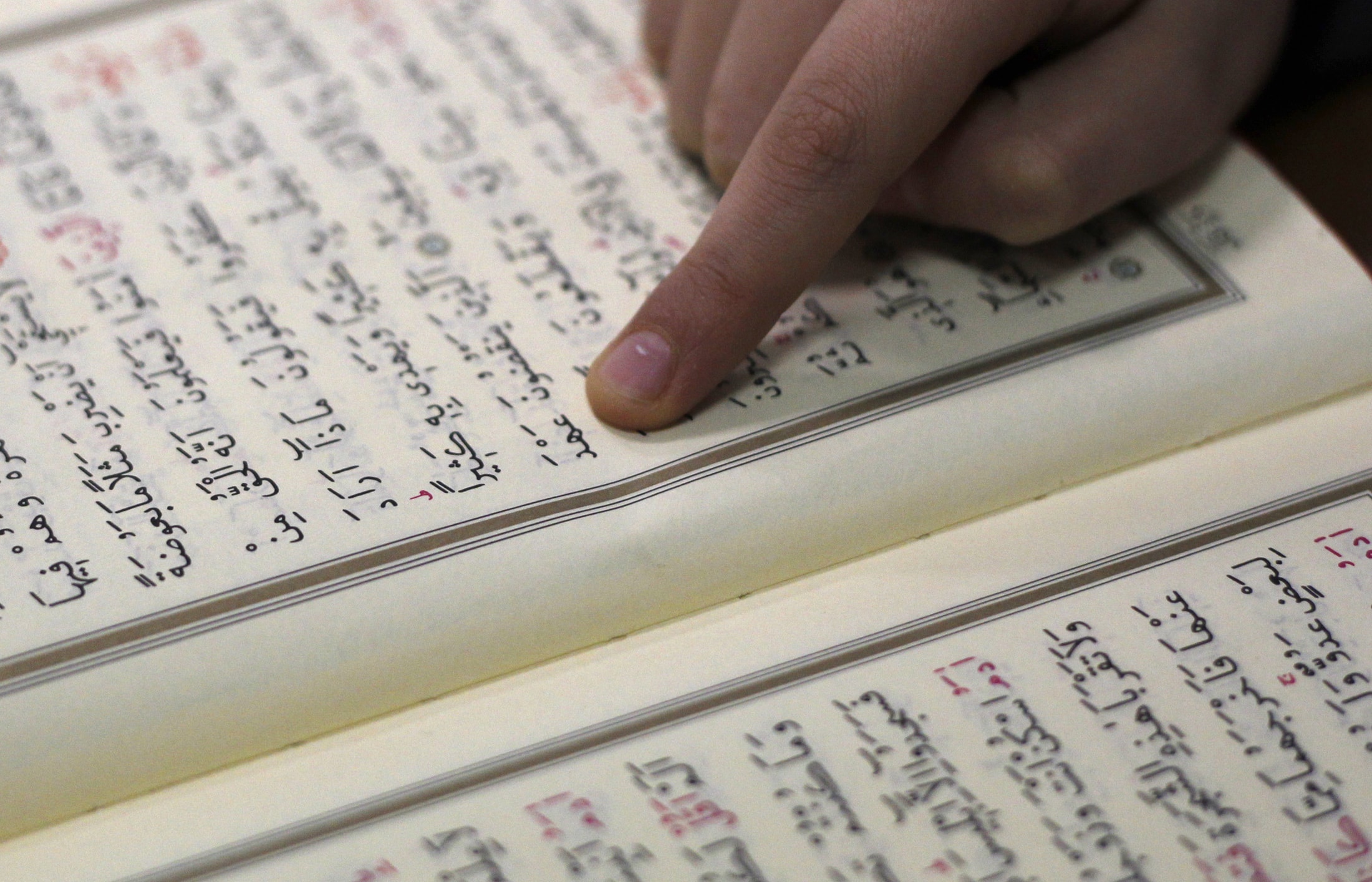 A closeup of pages of the Qur'an, REUTERS/Ina Fassbender