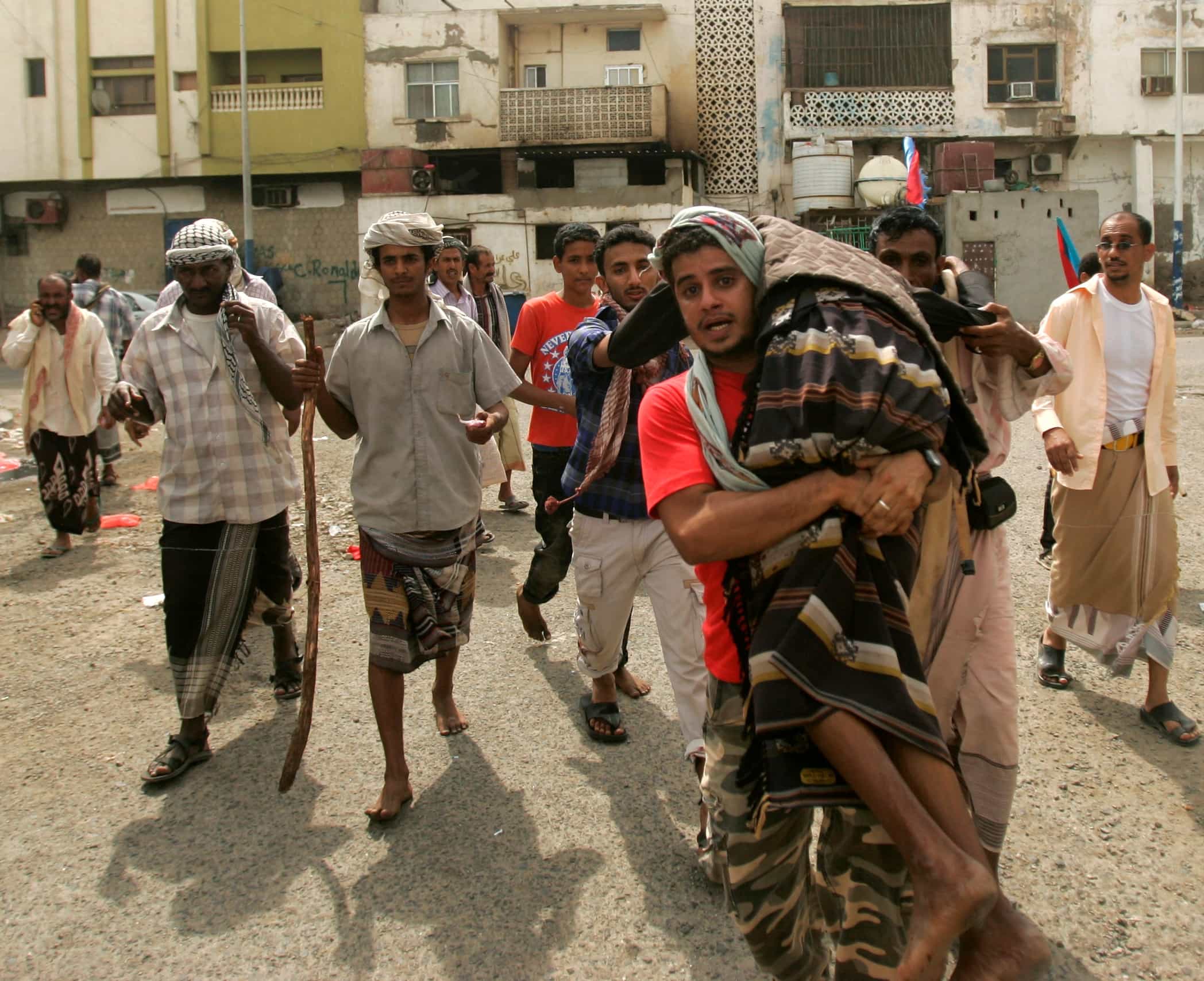 An injured supporter of the separatist Southern Movement is carried to an ambulance during clashes with security forces in Aden on 21 February 2013, ahead of planned rallies to mark the first anniversary of ex-president Ali Abdullah Saleh's ouster, REUTERS/Khaled Abdullah