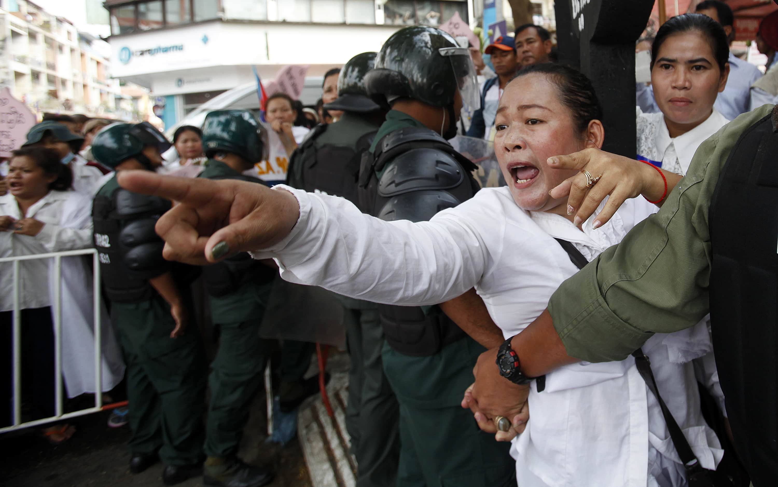 Protesters attempt to march to the Supreme Court during a demonstration in central Phnom Penh on 3 March 2014. Protesters demanded the release of 21 detainees who have been jailed since 3 January, when military police opened fire on workers striking over low pay, killing four people., REUTERS/Samrang Pring