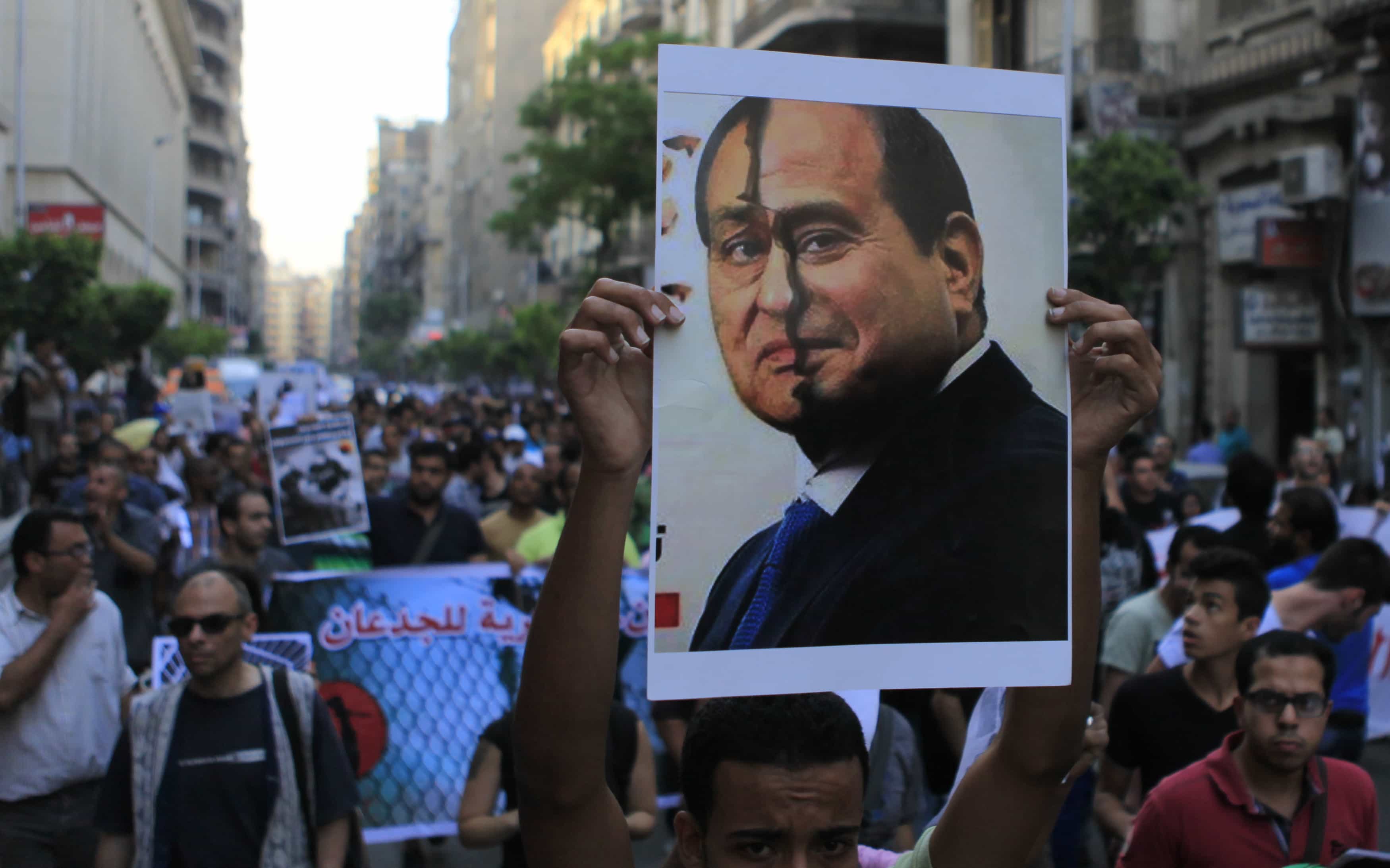 Activists during a protest against presidential candidate Abdel Fattah al-Sisi and a law restricting demonstrations as well as the crackdown on activists, in downtown Cairo on 24 May 2014, REUTERS/Amr Abdallah Dalsh